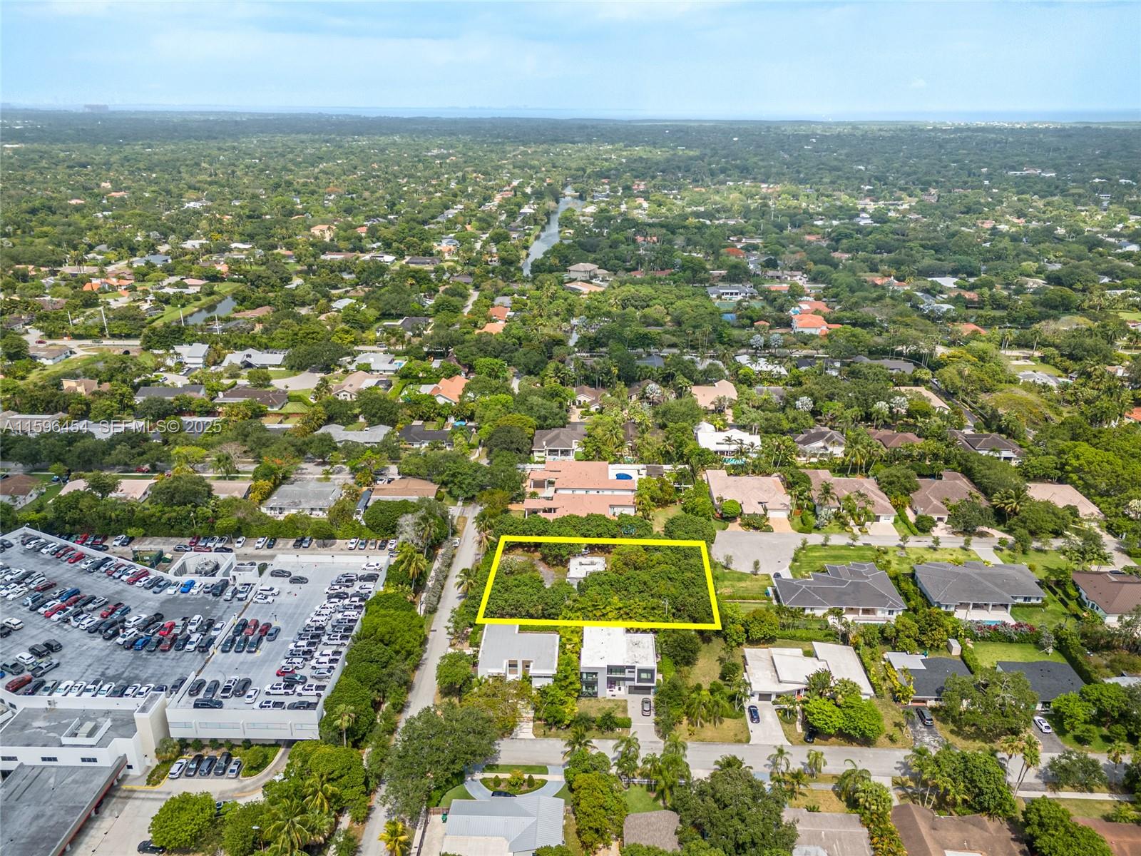 7800 Southwest 110th Street Pinecrest, FL 33156 - Photo 9 of 12 an aerial view of residential houses with outdoor space