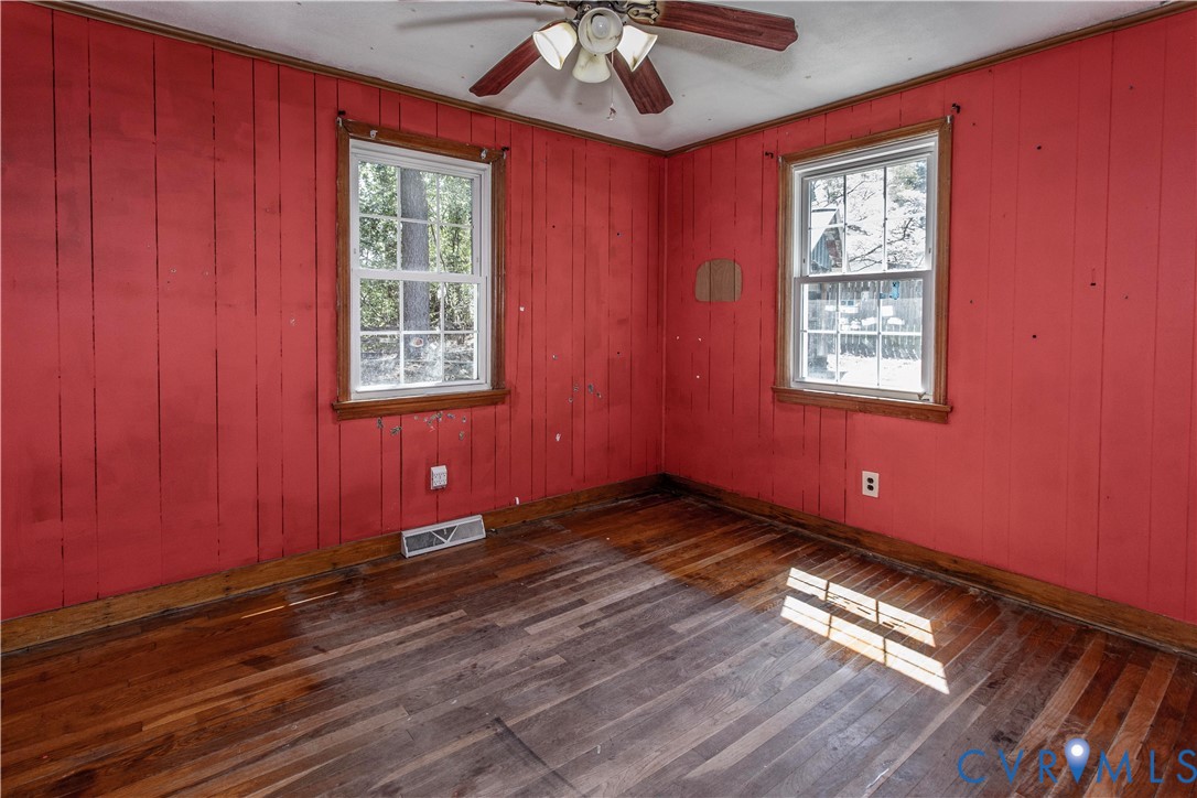 121 Lakeside Drive Colonial Heights, VA 23834 - Photo 12 of 28 a view of an empty room with wooden floor and a window