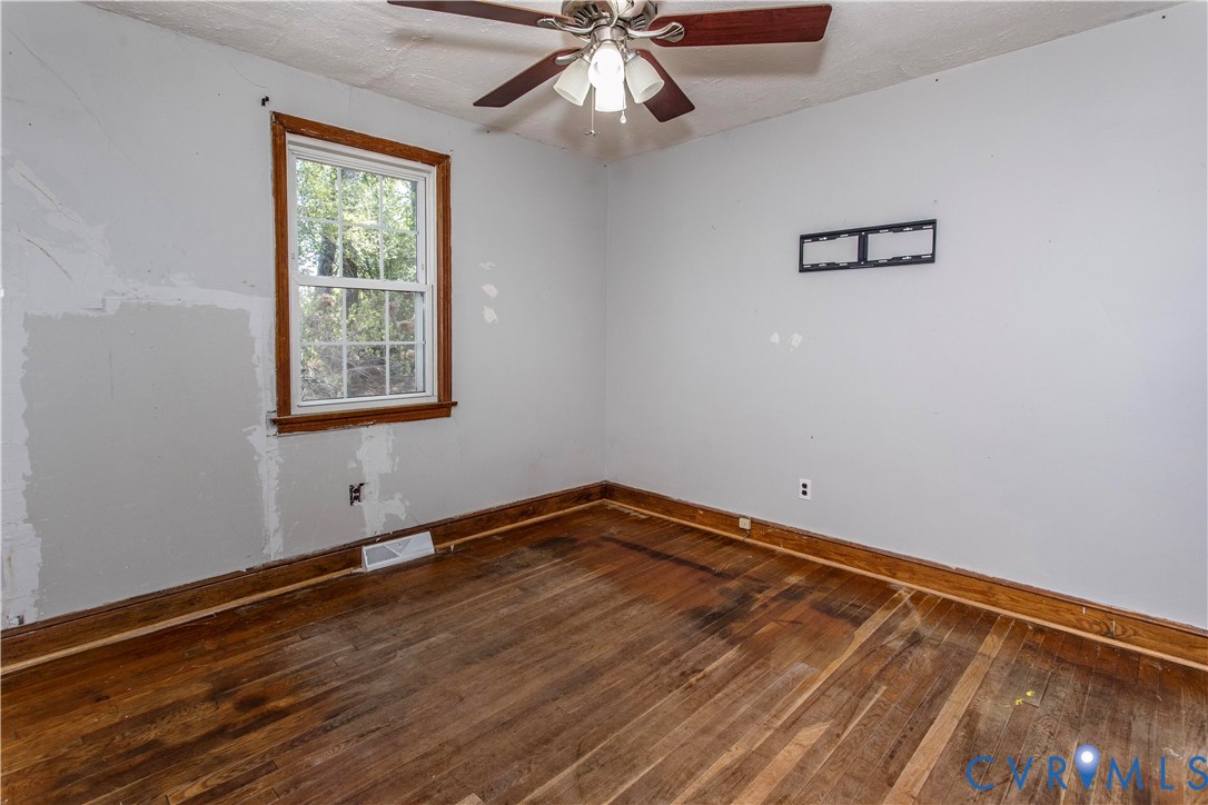121 Lakeside Drive Colonial Heights, VA 23834 - Photo 14 of 28 a view of an empty room with wooden floor and a window