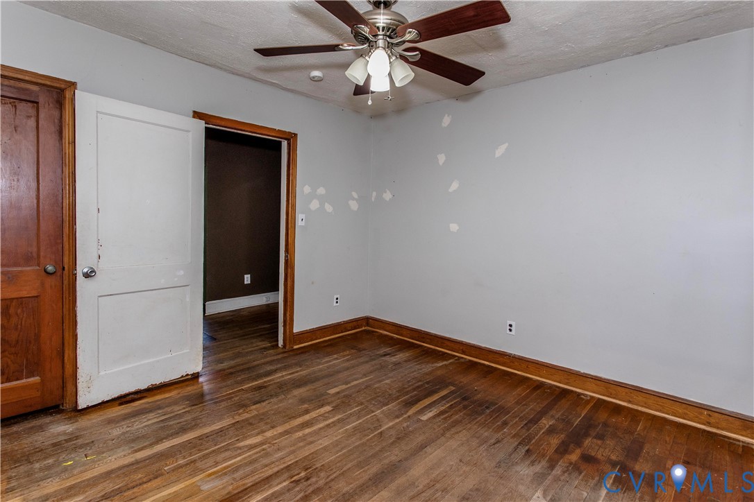 121 Lakeside Drive Colonial Heights, VA 23834 - Photo 15 of 28 an empty room with wooden floor closet and ceiling fan