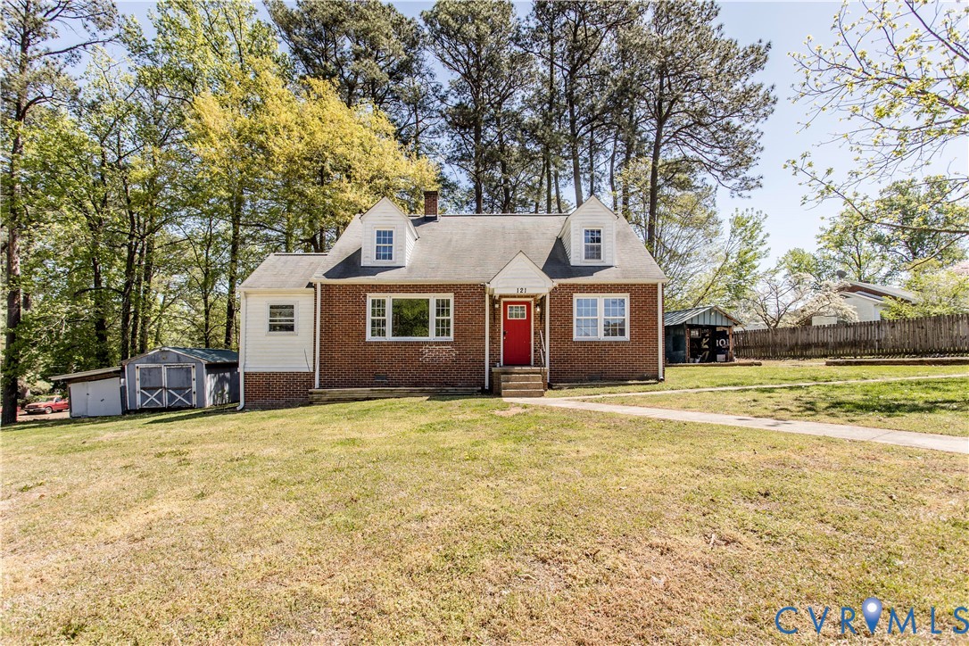 121 Lakeside Drive Colonial Heights, VA 23834 - Photo 2 of 28 a front view of a house with a garden
