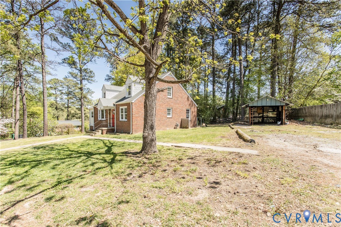 121 Lakeside Drive Colonial Heights, VA 23834 - Photo 26 of 28 a house with trees in front of it