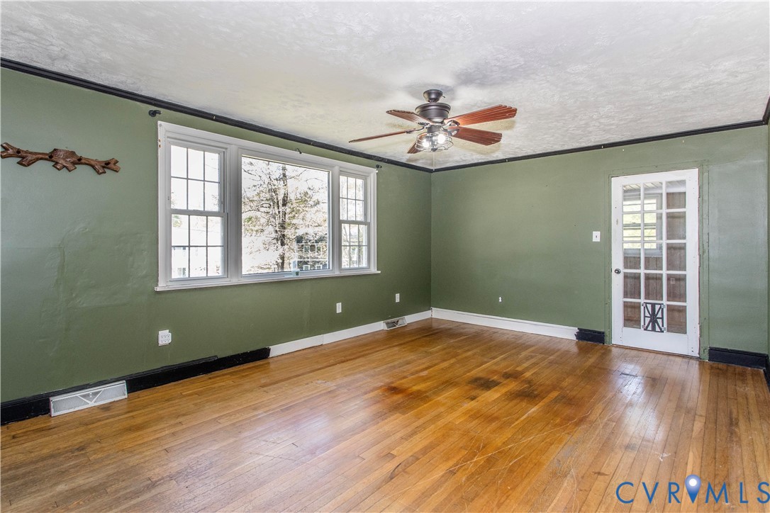 121 Lakeside Drive Colonial Heights, VA 23834 - Photo 8 of 28 wooden floor in an empty room with a window