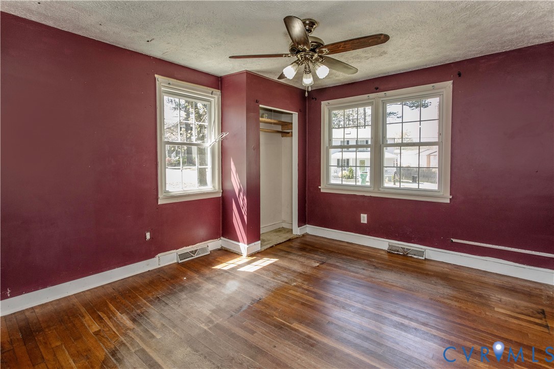 121 Lakeside Drive Colonial Heights, VA 23834 - Photo 10 of 28 a view of an empty room with wooden floor and a window