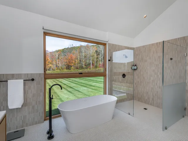 a bathroom with a shower and a bathtub
