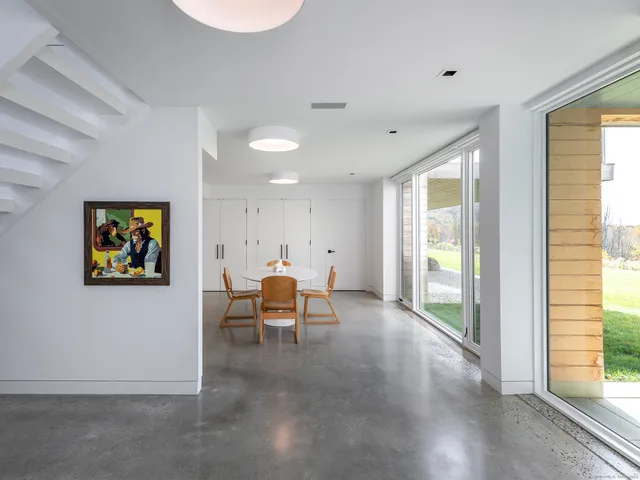 a view of a livingroom with furniture and window