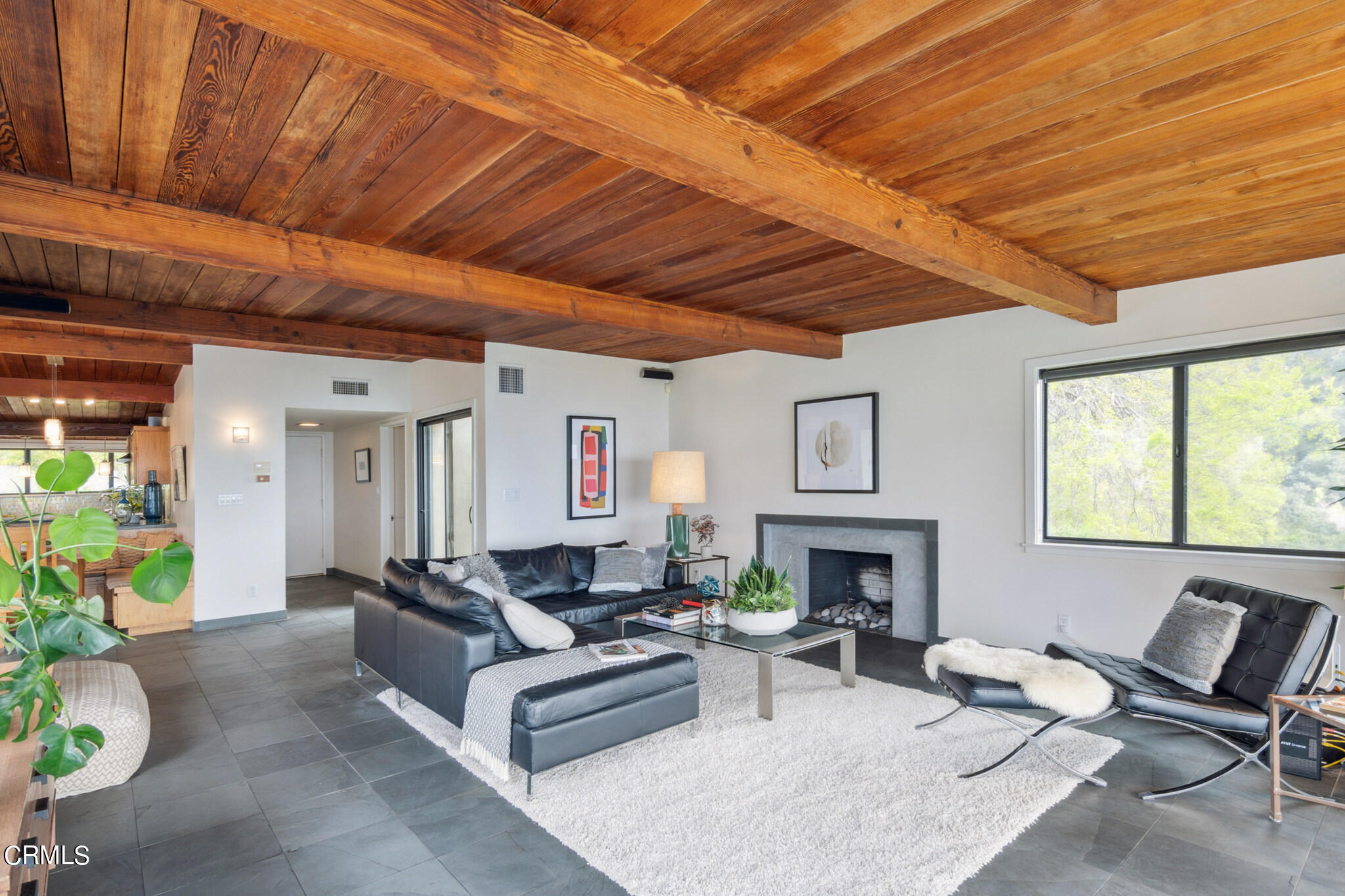 4554 Rising Hill Road Altadena, CA 91001 - Photo 12 of 56 a living room with furniture flat screen tv and a fireplace