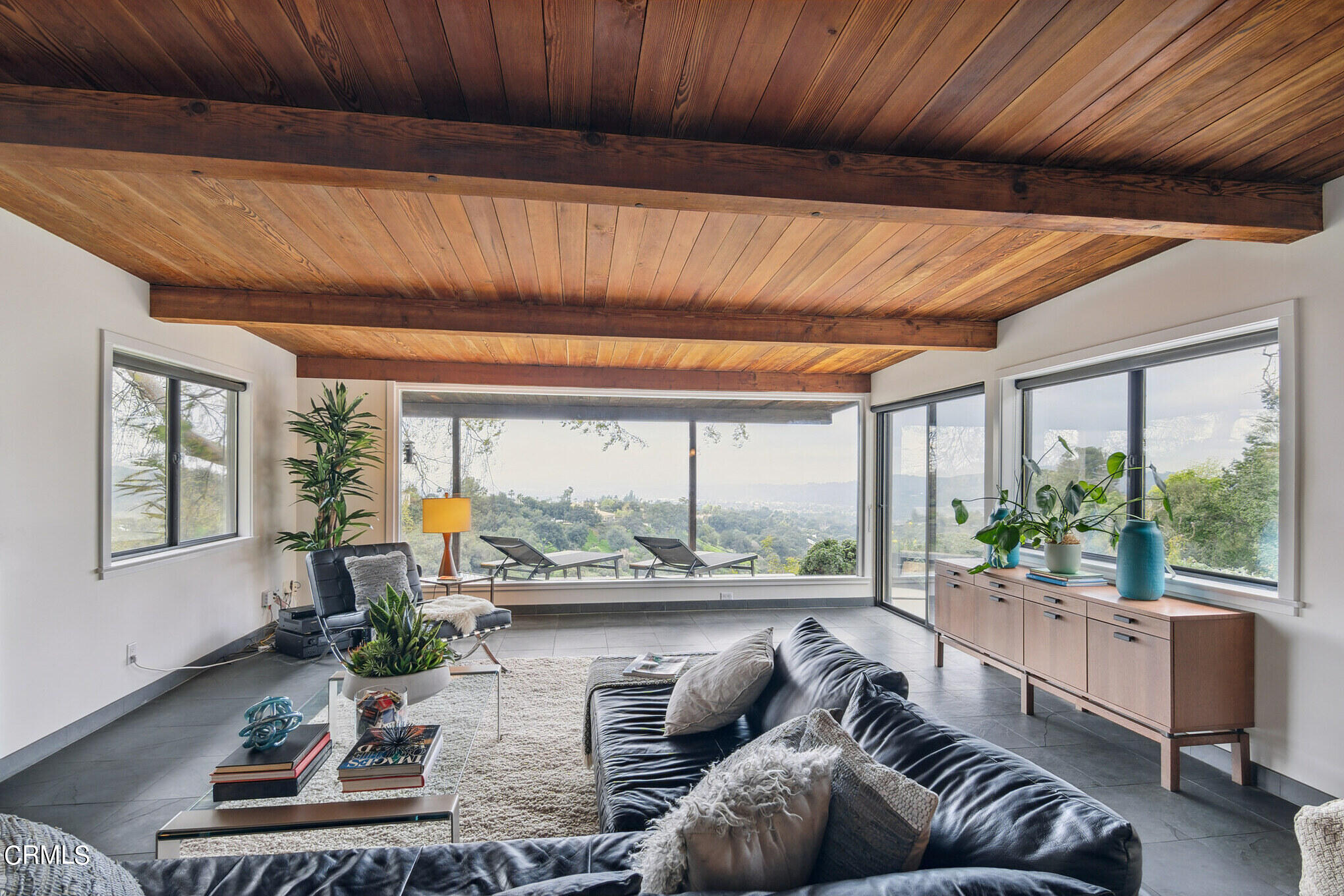 4554 Rising Hill Road Altadena, CA 91001 - Photo 13 of 56 a living room with furniture and a large window