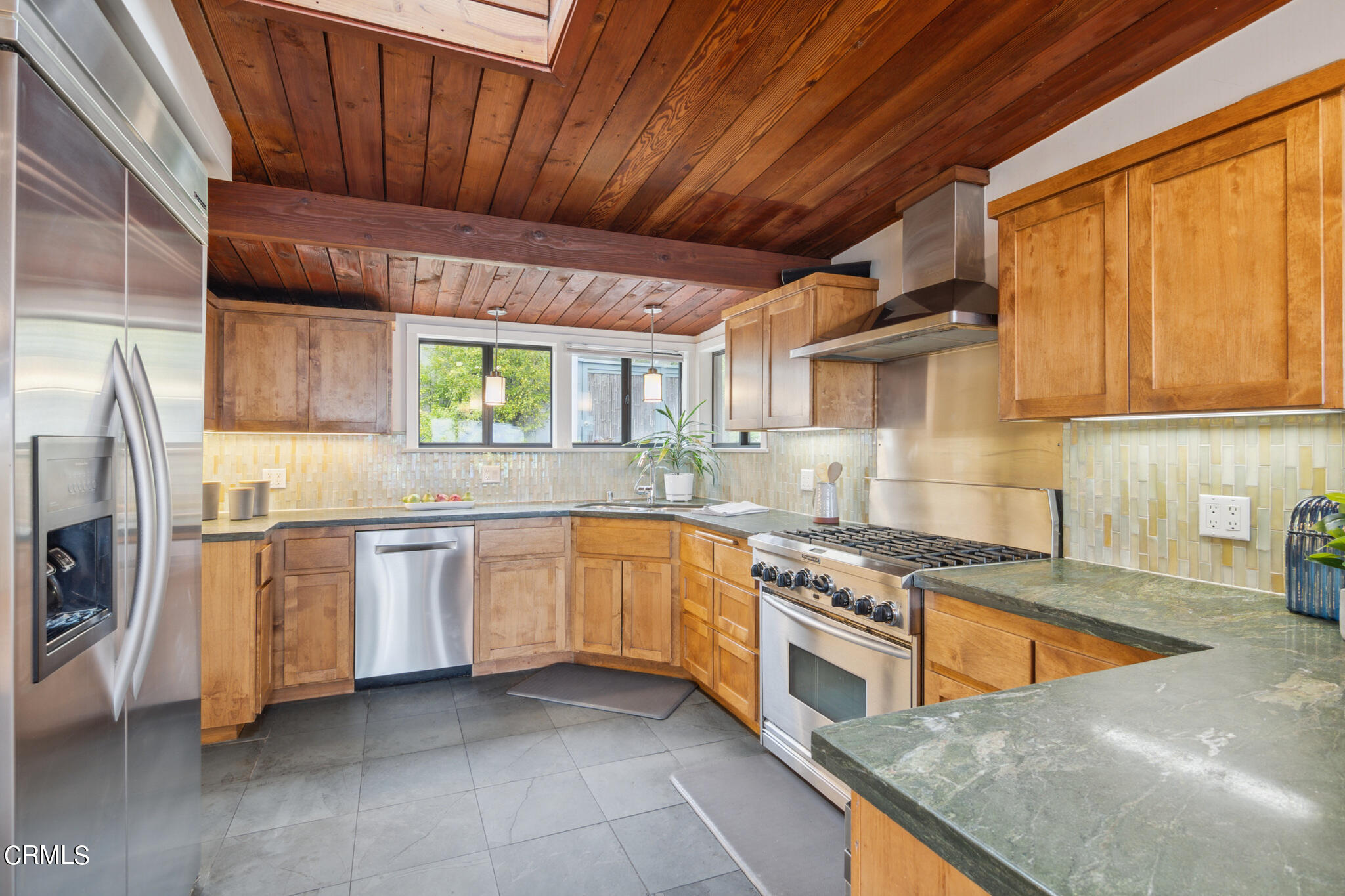 4554 Rising Hill Road Altadena, CA 91001 - Photo 17 of 56 a kitchen with stainless steel appliances granite countertop wooden cabinets a sink and a stove
