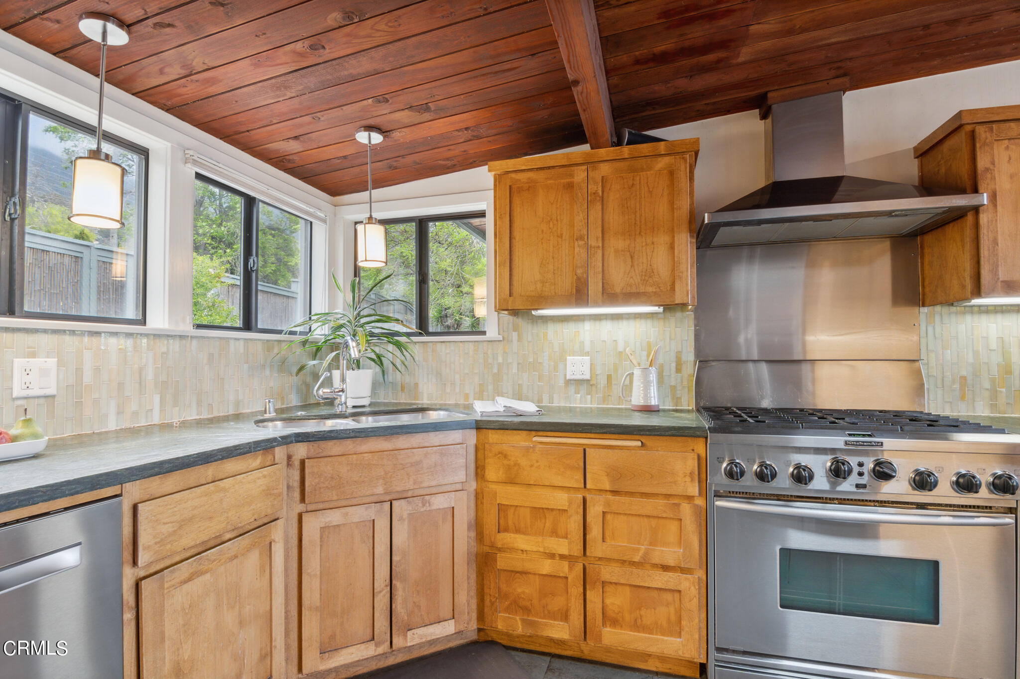 4554 Rising Hill Road Altadena, CA 91001 - Photo 18 of 56 a kitchen with granite countertop wooden cabinets stainless steel appliances and a sink