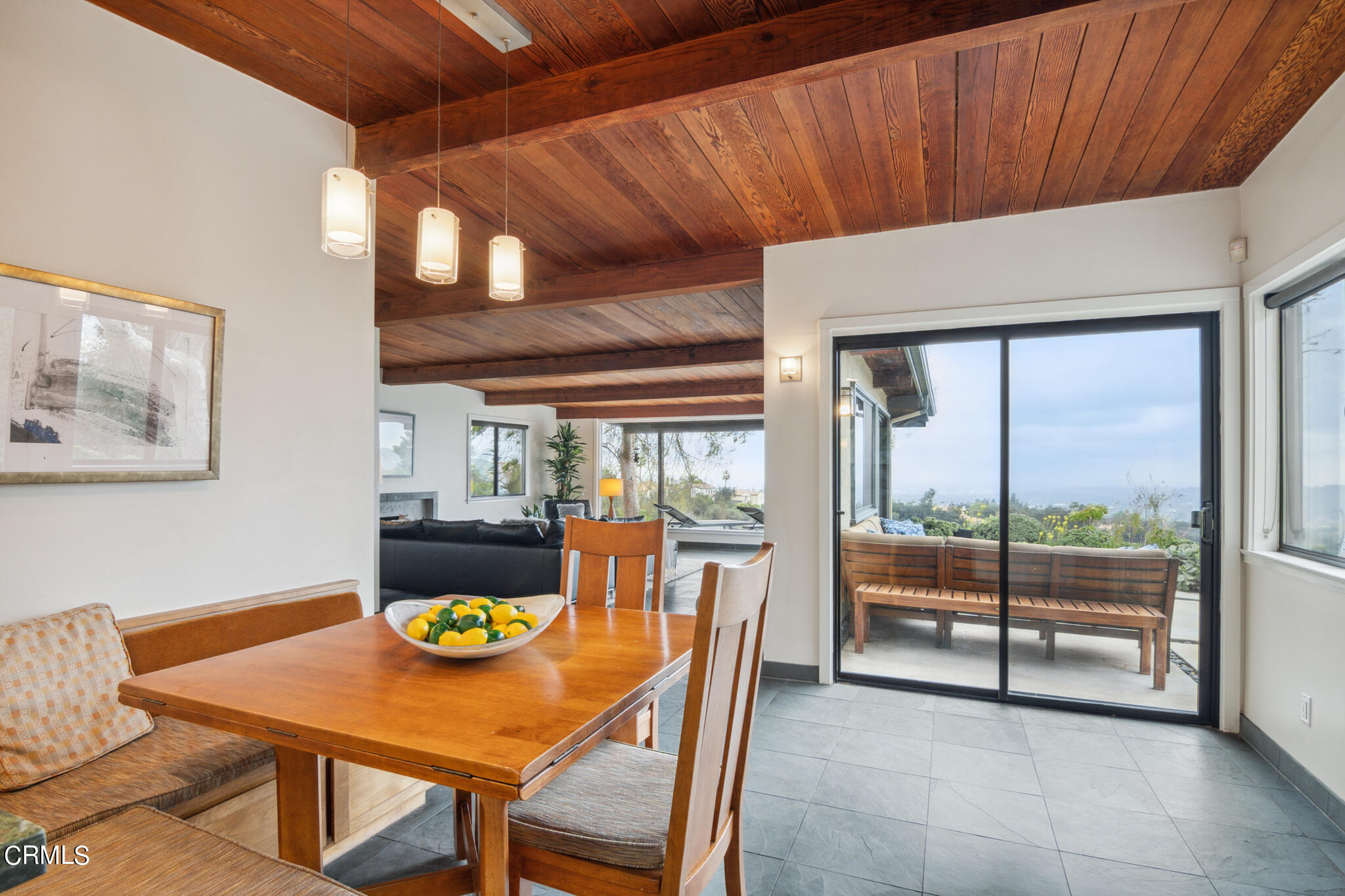 4554 Rising Hill Road Altadena, CA 91001 - Photo 20 of 56 a dining room with furniture and a floor to ceiling window