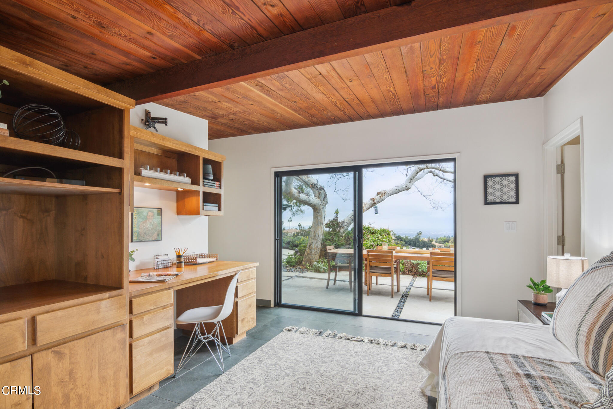 4554 Rising Hill Road Altadena, CA 91001 - Photo 26 of 56 a bedroom with furniture and large window
