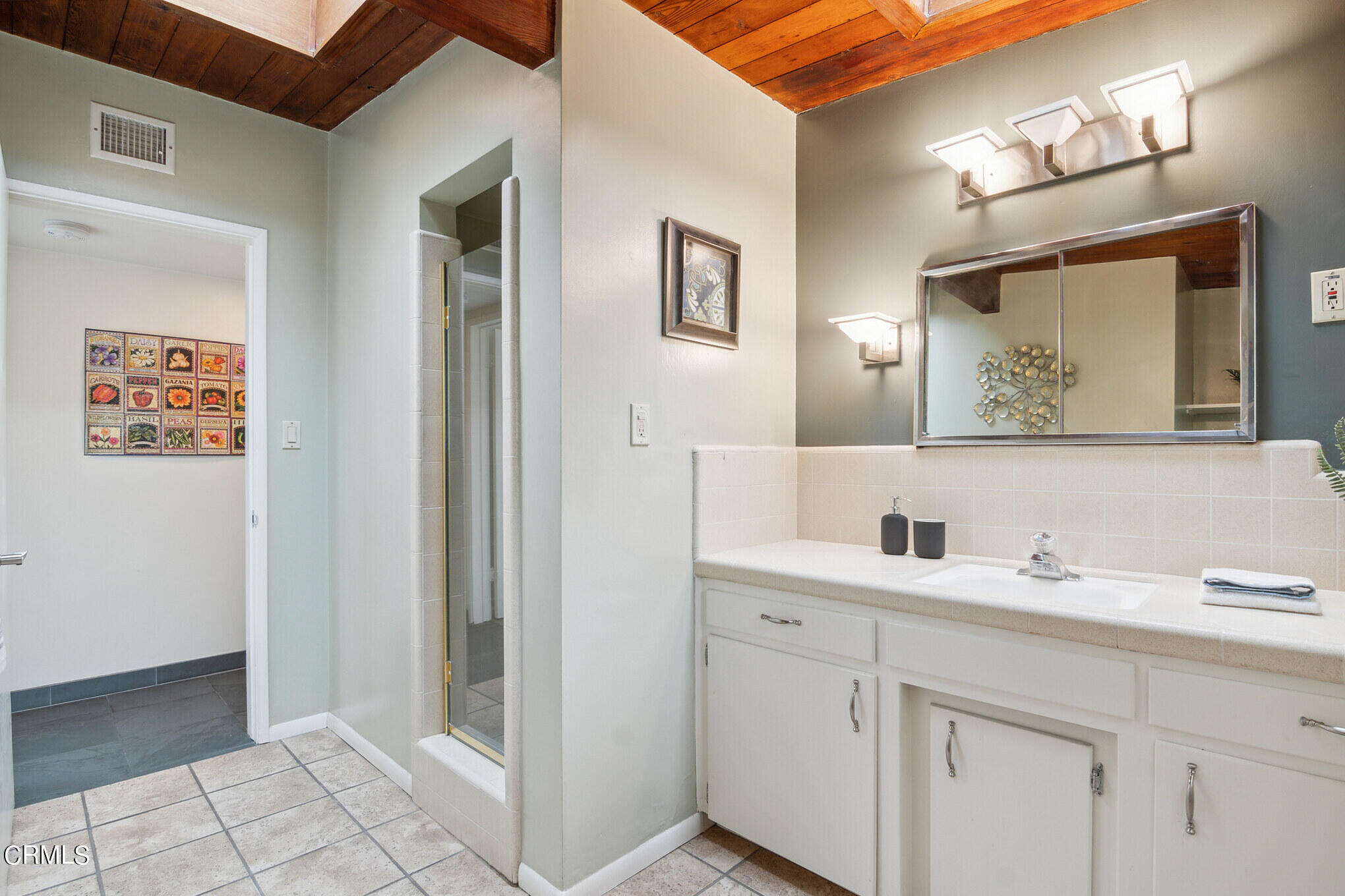 4554 Rising Hill Road Altadena, CA 91001 - Photo 29 of 56 a bathroom with a sink and a mirror