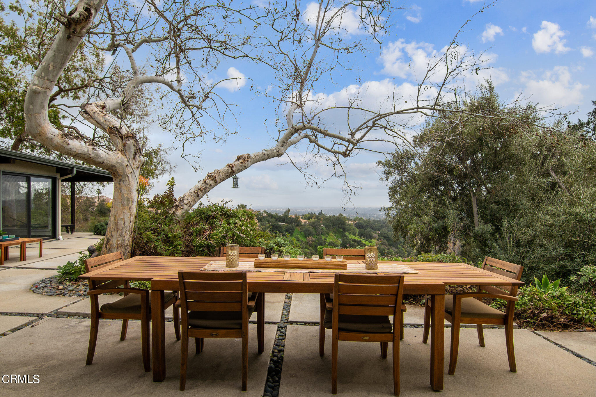 4554 Rising Hill Road Altadena, CA 91001 - Photo 30 of 56 a view of an outdoor space with table and chair