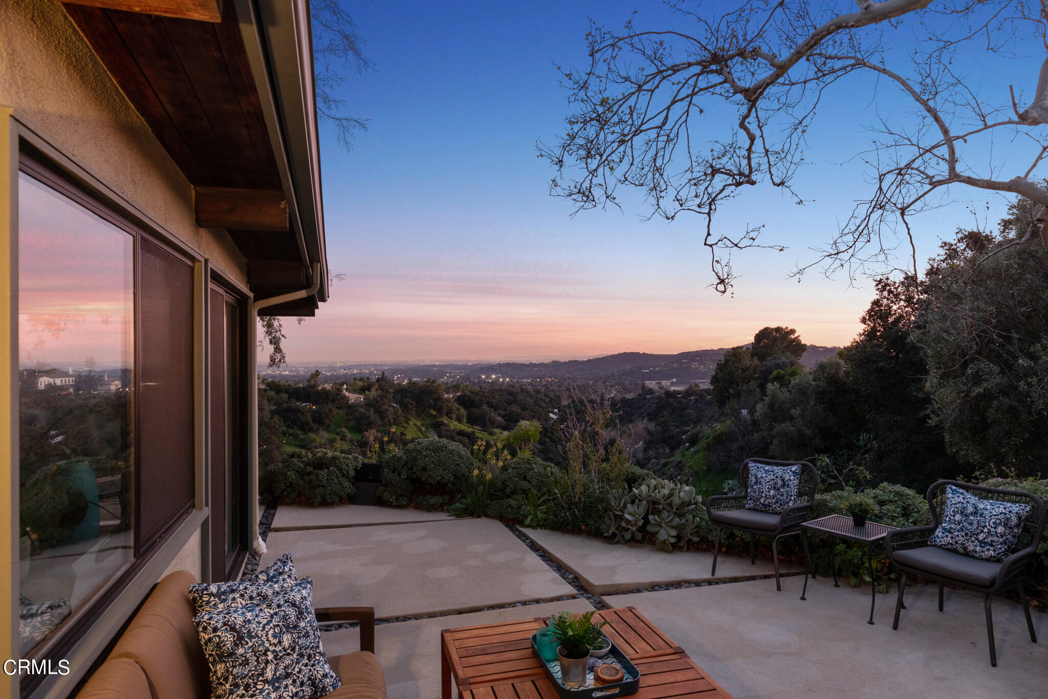 4554 Rising Hill Road Altadena, CA 91001 - Photo 6 of 56 a view of a patio with table and chairs and potted plants