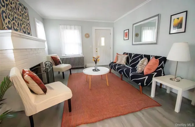 a living room with furniture and a lamp