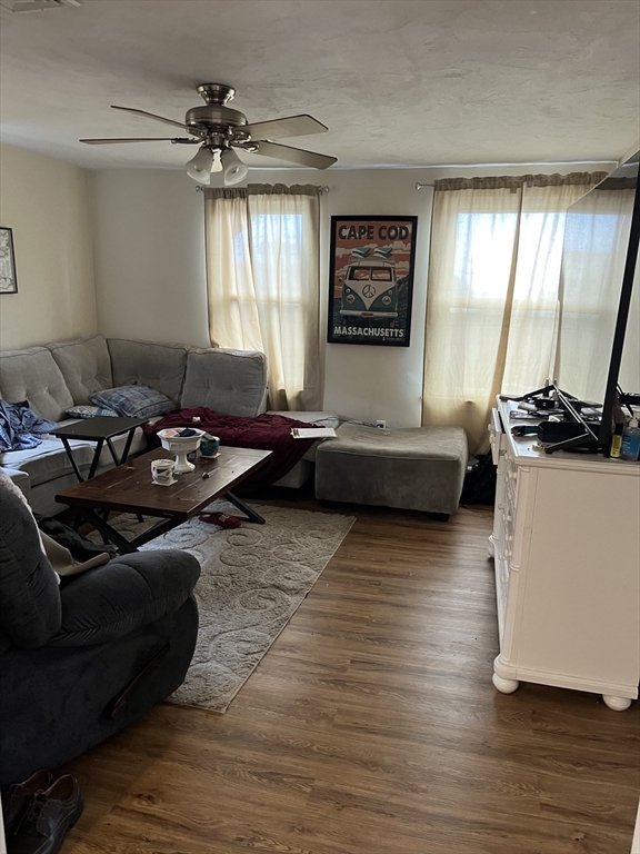 1768 Pleasant Street Fall River, MA 02723 - Photo 9 of 10 a living room with furniture window and wooden floor