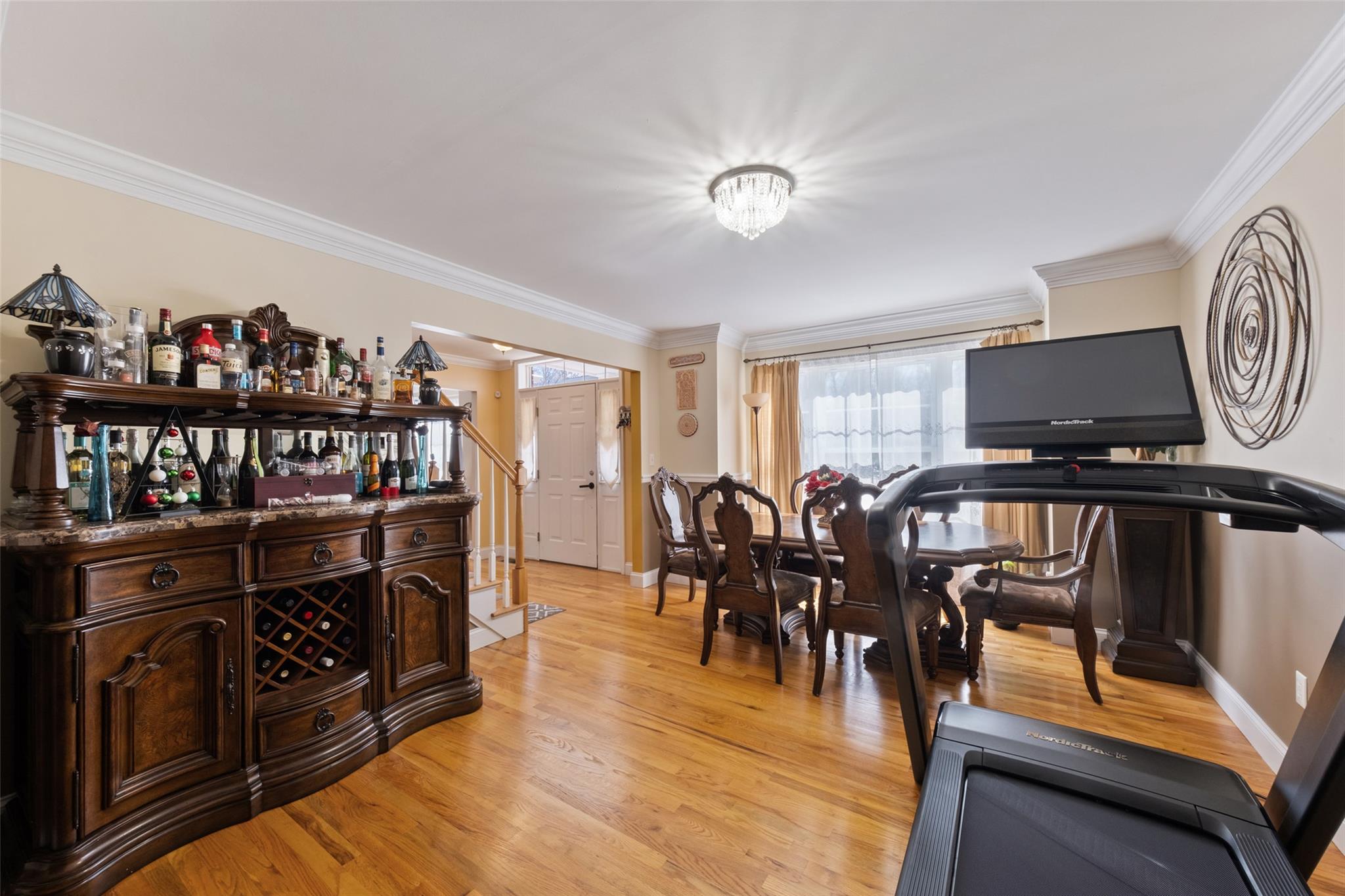 15 Bobrick Road Poughkeepsie, NY 12601 - Photo 11 of 36 Dining room with light wood-style flooring, baseboards, and ornamental molding
