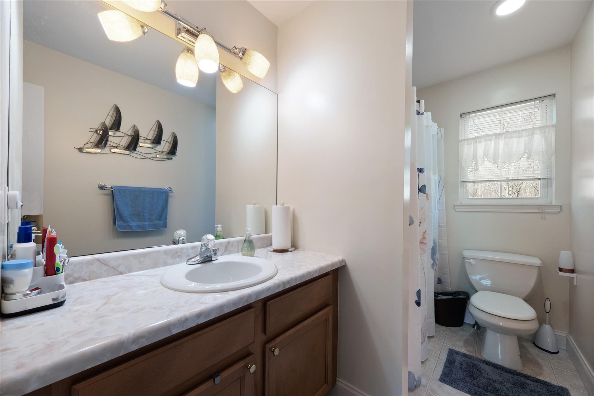 15 Bobrick Road Poughkeepsie, NY 12601 - Photo 21 of 36 Full bath featuring toilet, tile patterned floors, vanity, and baseboards