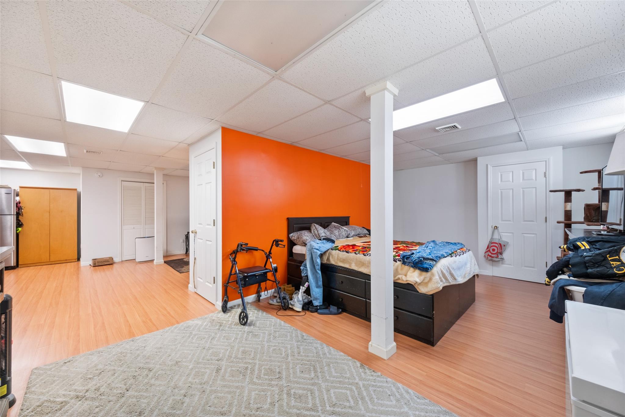 15 Bobrick Road Poughkeepsie, NY 12601 - Photo 25 of 36 Bedroom featuring visible vents, a drop ceiling, baseboards, and wood finished floors