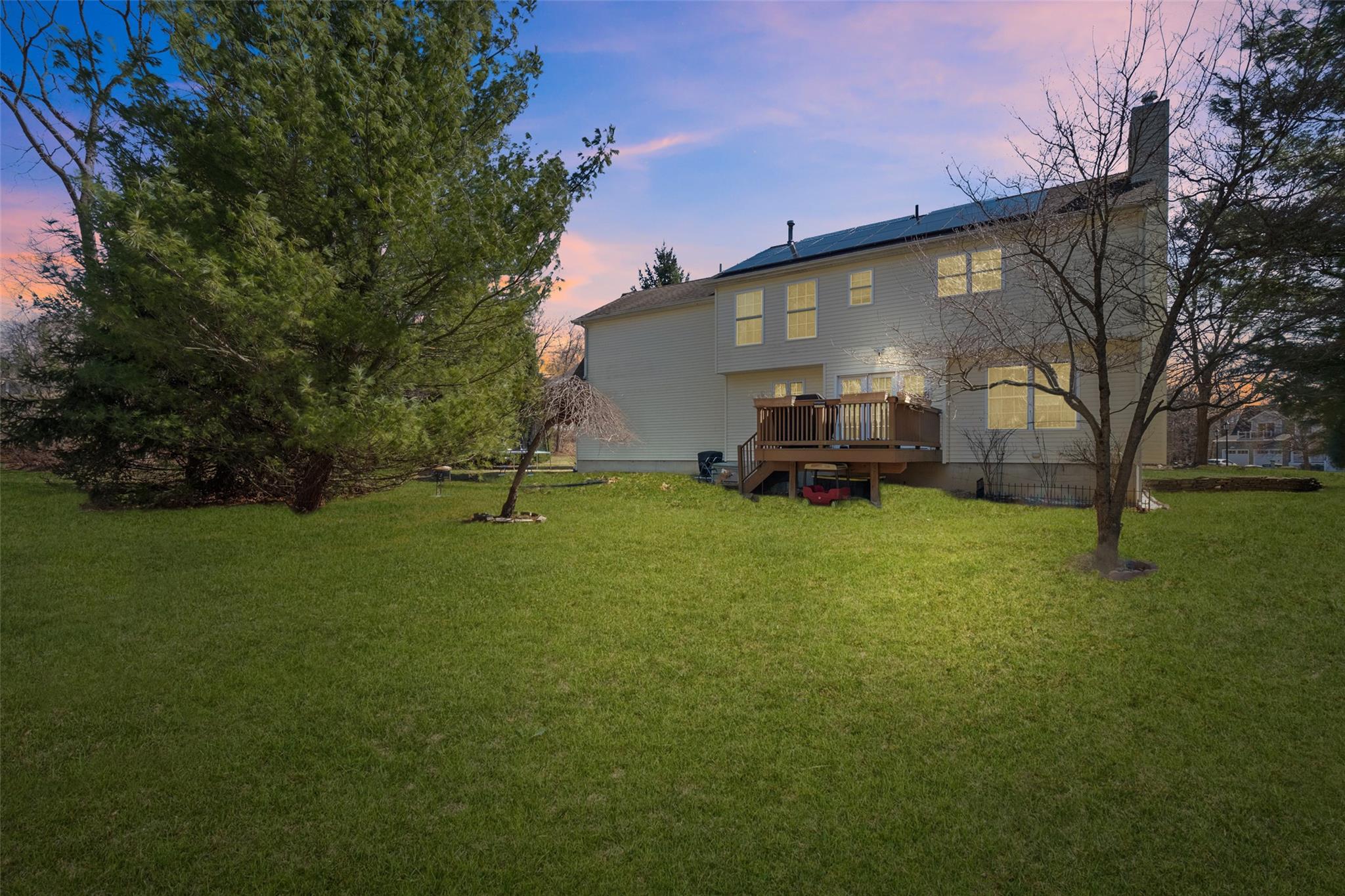 15 Bobrick Road Poughkeepsie, NY 12601 - Photo 32 of 36 Rear view of property featuring a chimney, a wooden deck, and a yard
