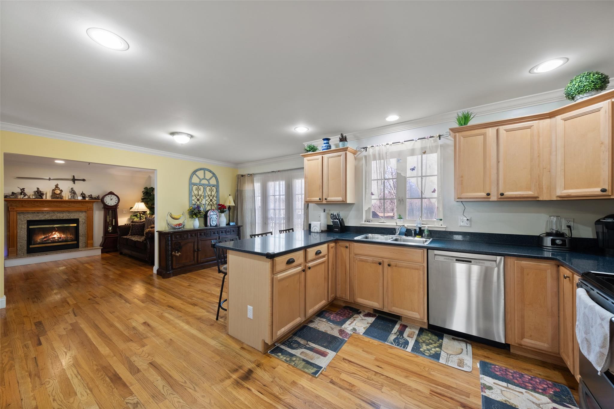 15 Bobrick Road Poughkeepsie, NY 12601 - Photo 4 of 36 Kitchen with a sink, a kitchen bar, crown molding, stainless steel dishwasher, and electric range