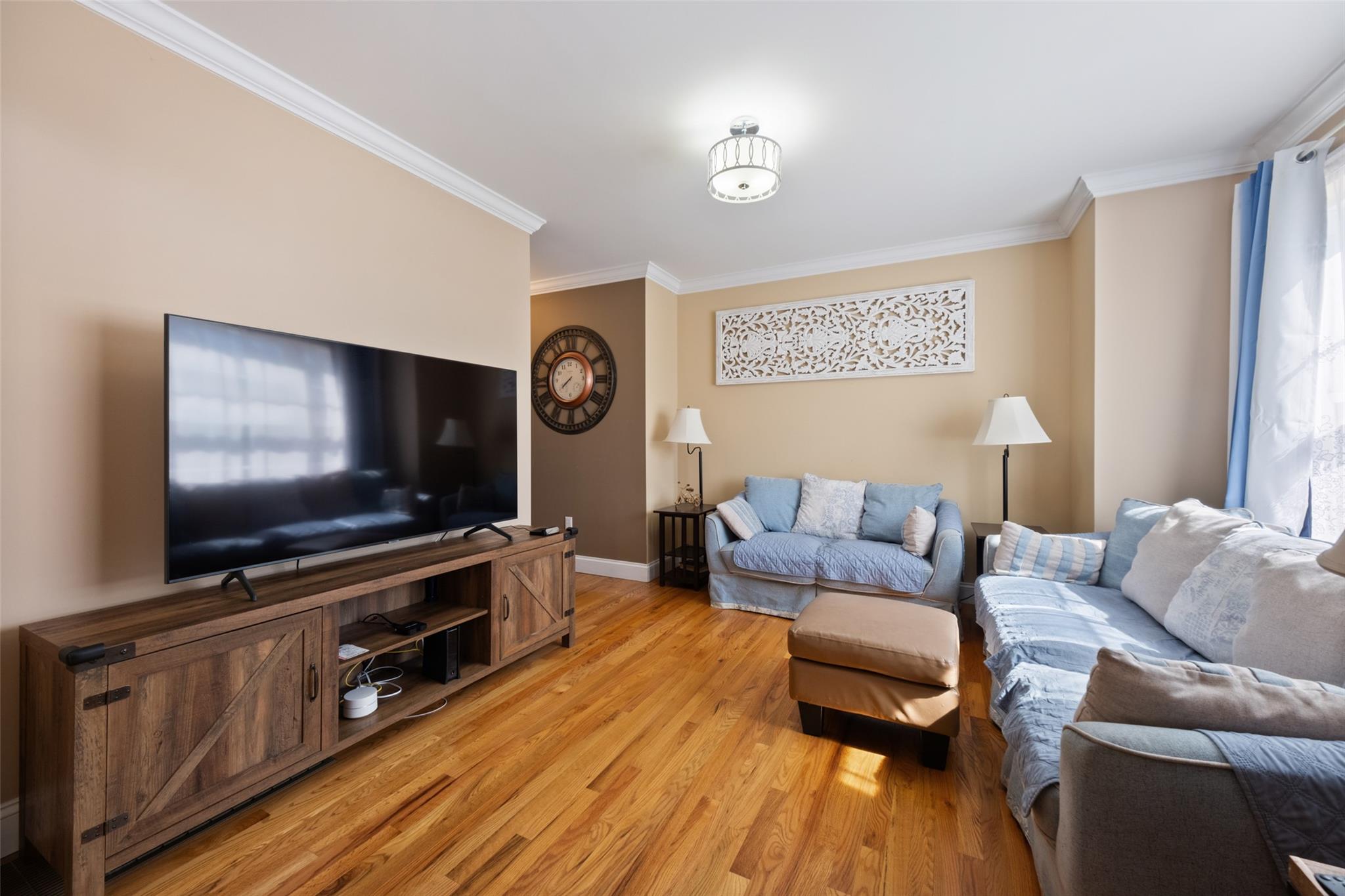 15 Bobrick Road Poughkeepsie, NY 12601 - Photo 7 of 36 Living room featuring light wood finished floors, baseboards, and ornamental molding
