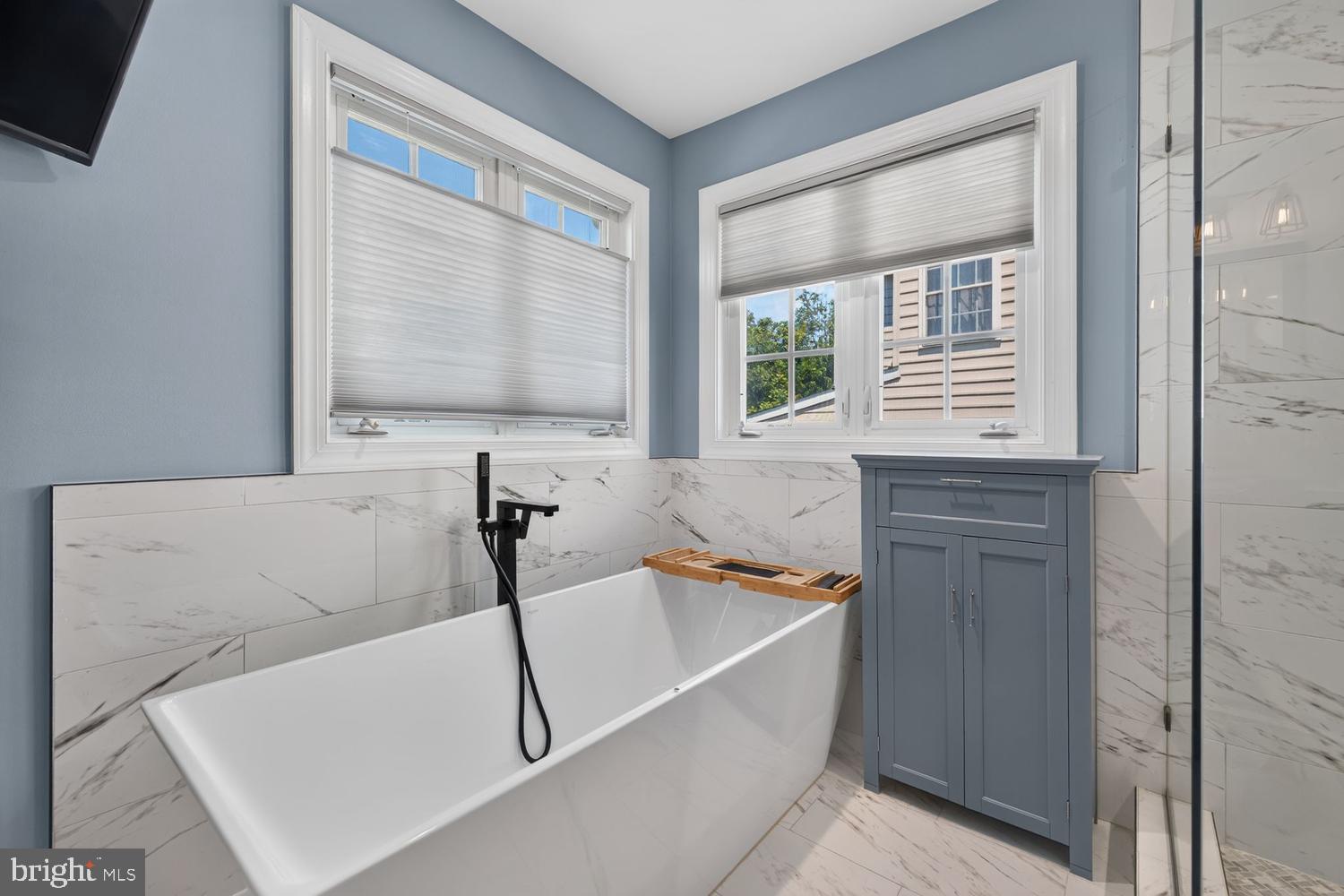23106 Birch Mead Road Clarksburg, MD 20871 - Photo 23 of 60 a bathroom with a bathtub and a sink