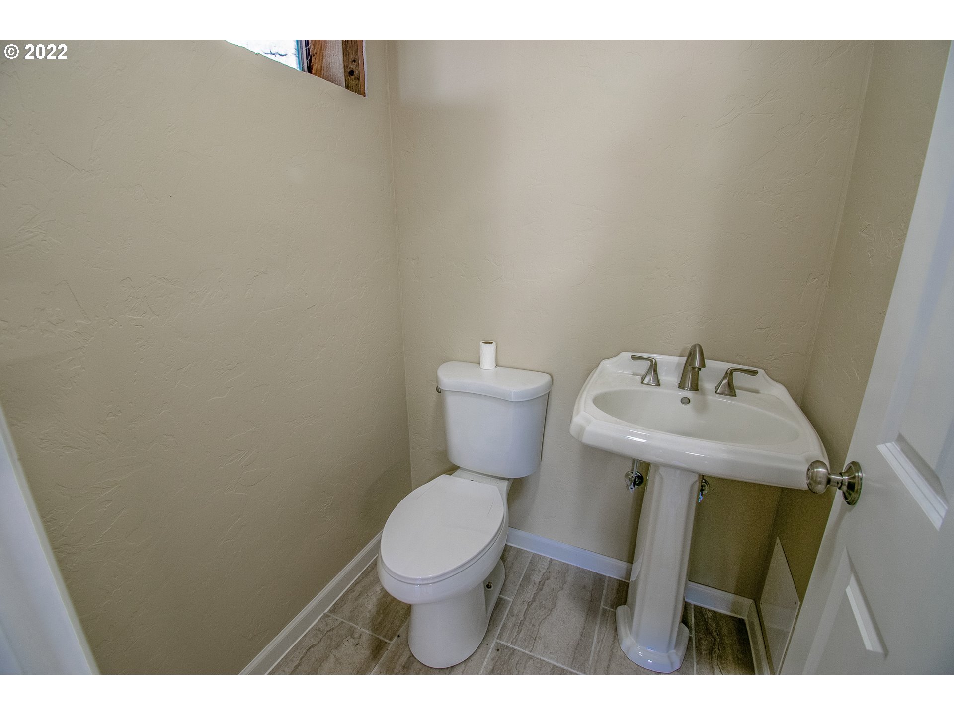 864 South 73rd Street Springfield, OR 97478 - Photo 23 of 30 a bathroom with a sink and a toilet