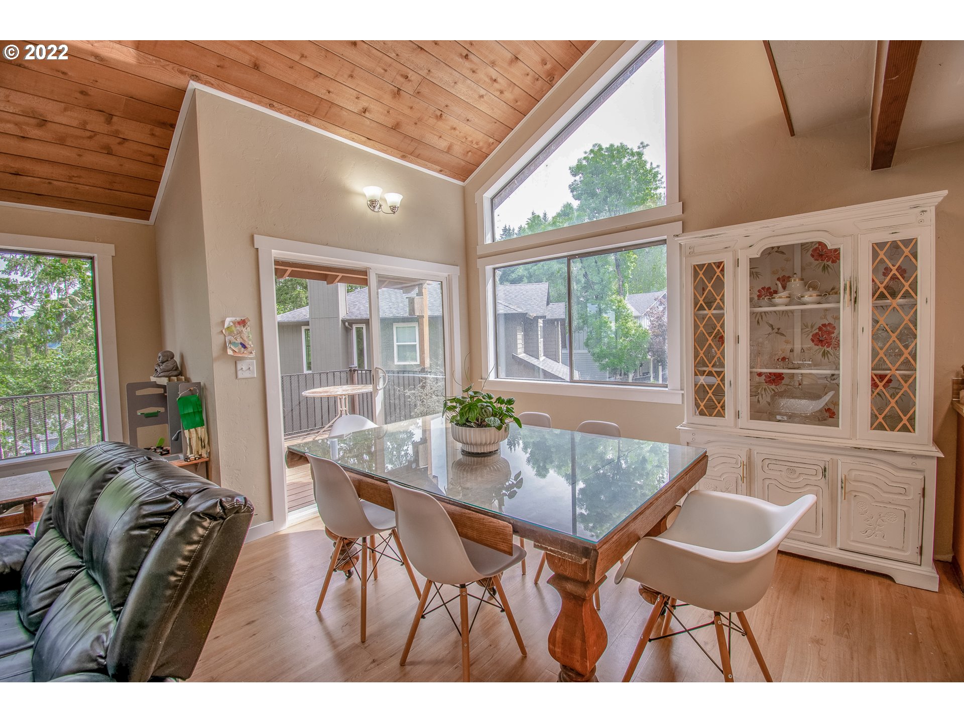 864 South 73rd Street Springfield, OR 97478 - Photo 6 of 30 a view of a dining room with furniture large windows and wooden floor