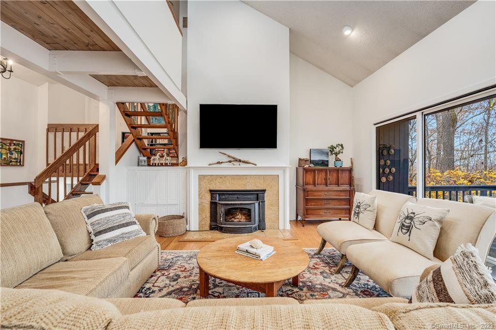 17 Kings Highway Chester, CT 06412 - Photo 1 of 1 a living room with furniture a fireplace and a flat screen tv