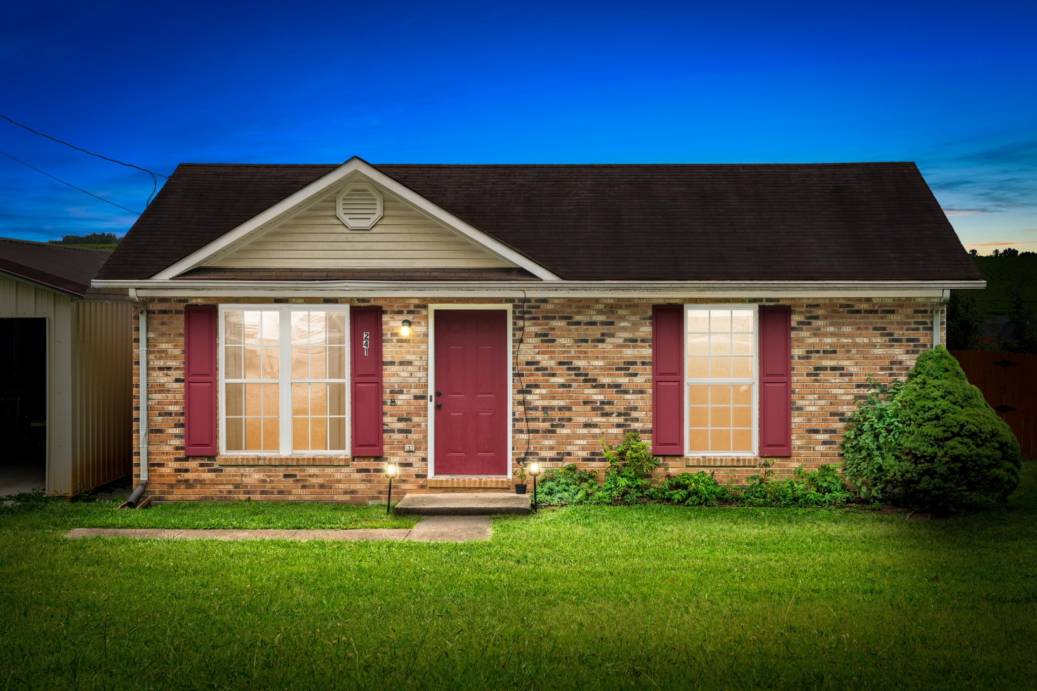 a front view of a house with a yard