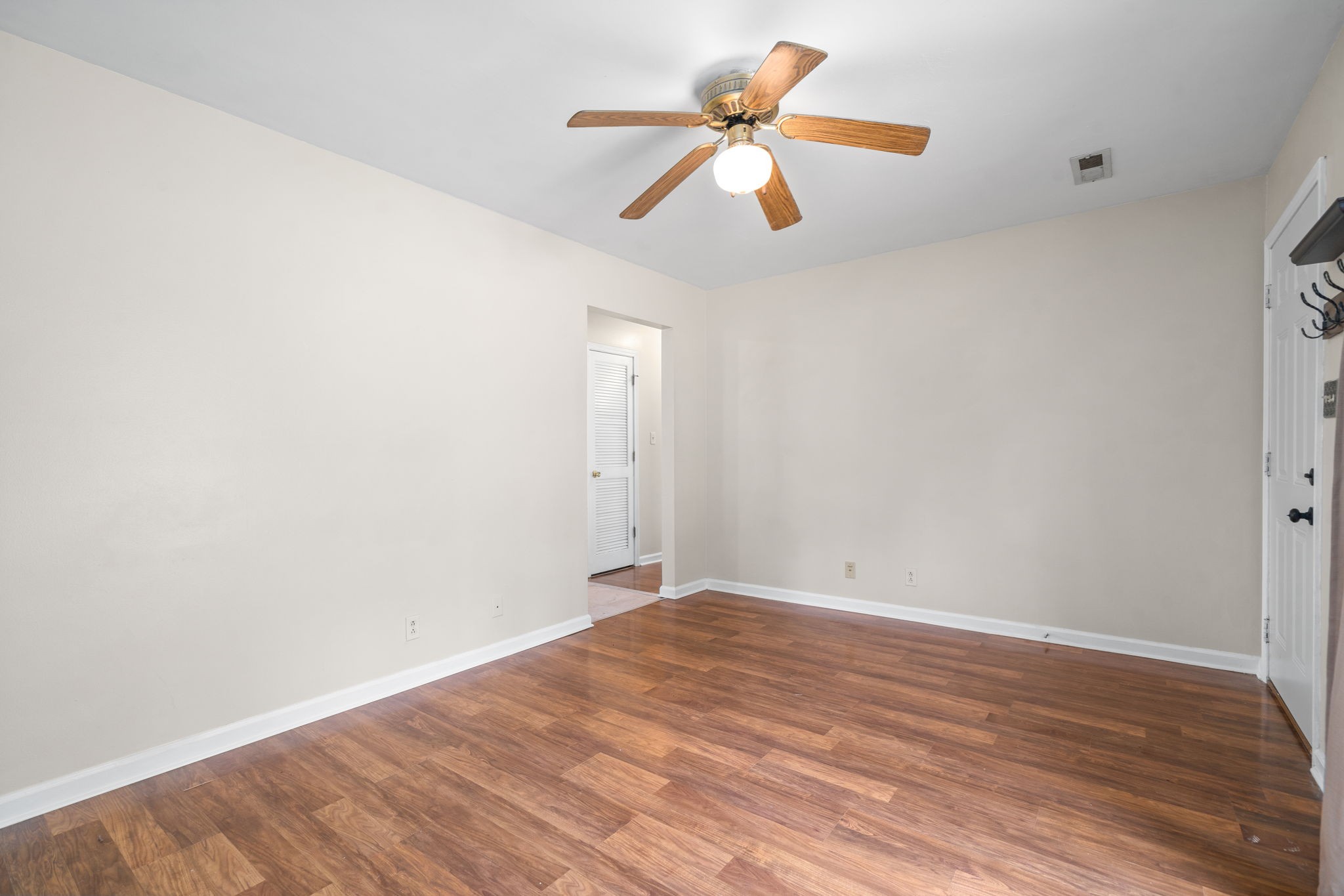 241 Bumpus Mill Road Oak Grove, KY 42262 - Photo 11 of 31 an empty room with wooden floor and windows