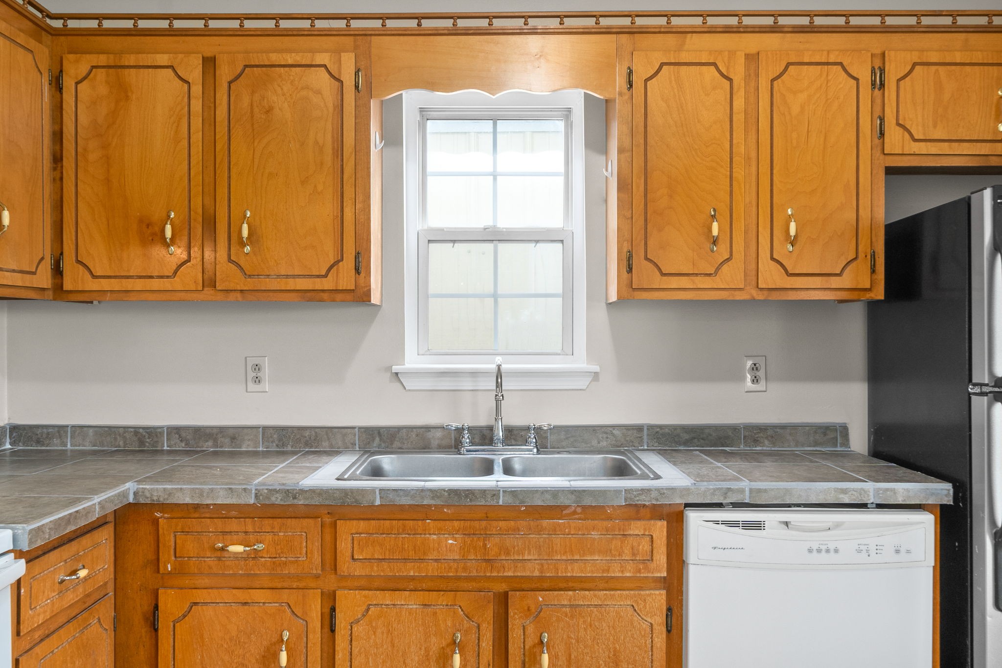 241 Bumpus Mill Road Oak Grove, KY 42262 - Photo 14 of 31 a kitchen with granite countertop a sink and cabinets