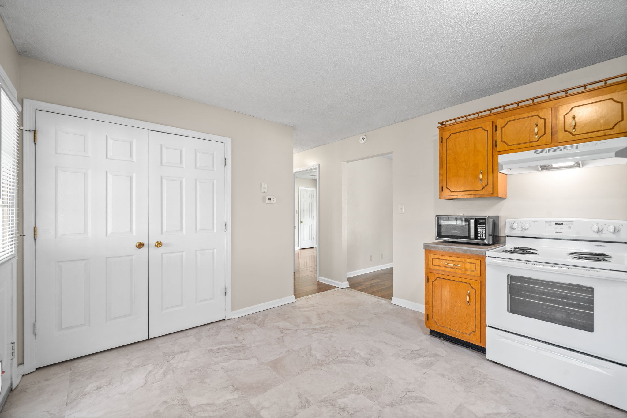 241 Bumpus Mill Road Oak Grove, KY 42262 - Photo 16 of 31 a view of a kitchen with stove and refrigerator
