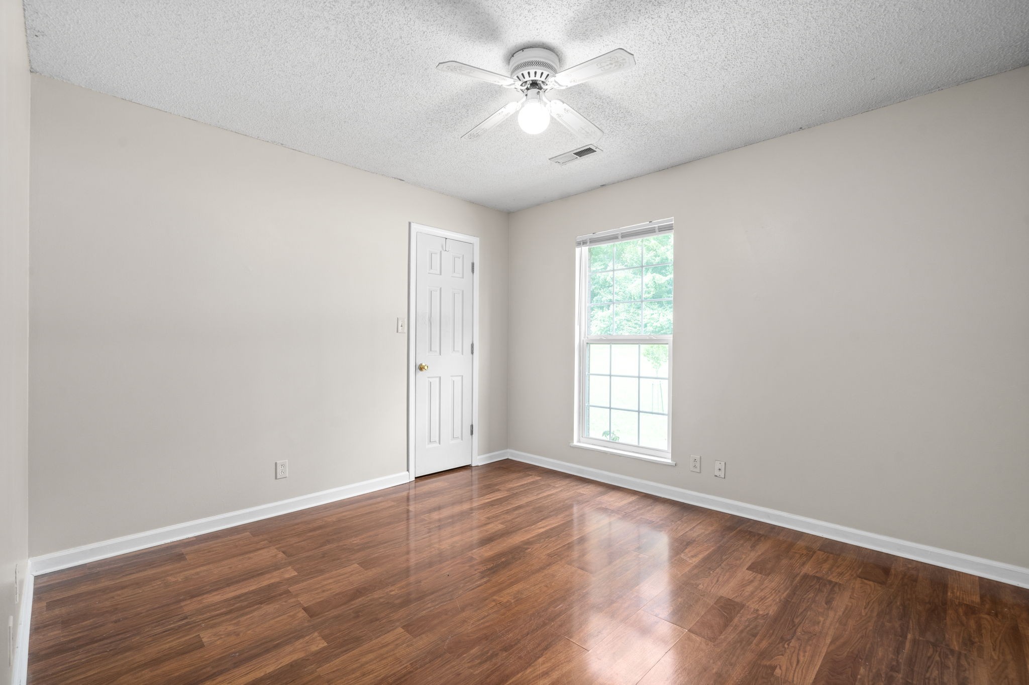 241 Bumpus Mill Road Oak Grove, KY 42262 - Photo 17 of 31 wooden floor in an empty room with a window