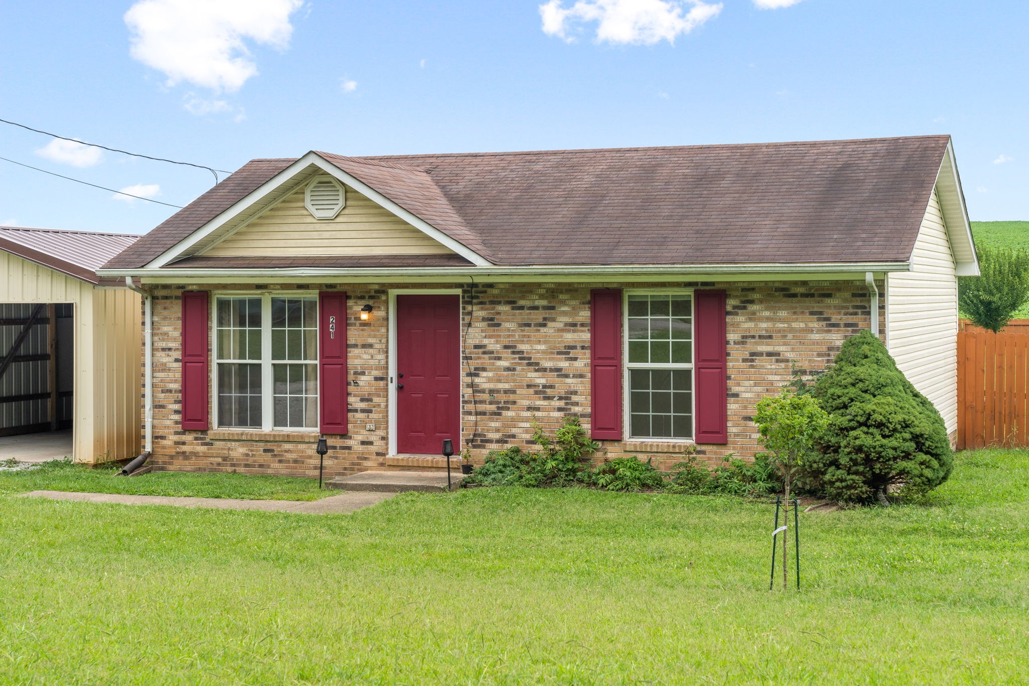241 Bumpus Mill Road Oak Grove, KY 42262 - Photo 2 of 31 a front view of a house with a yard