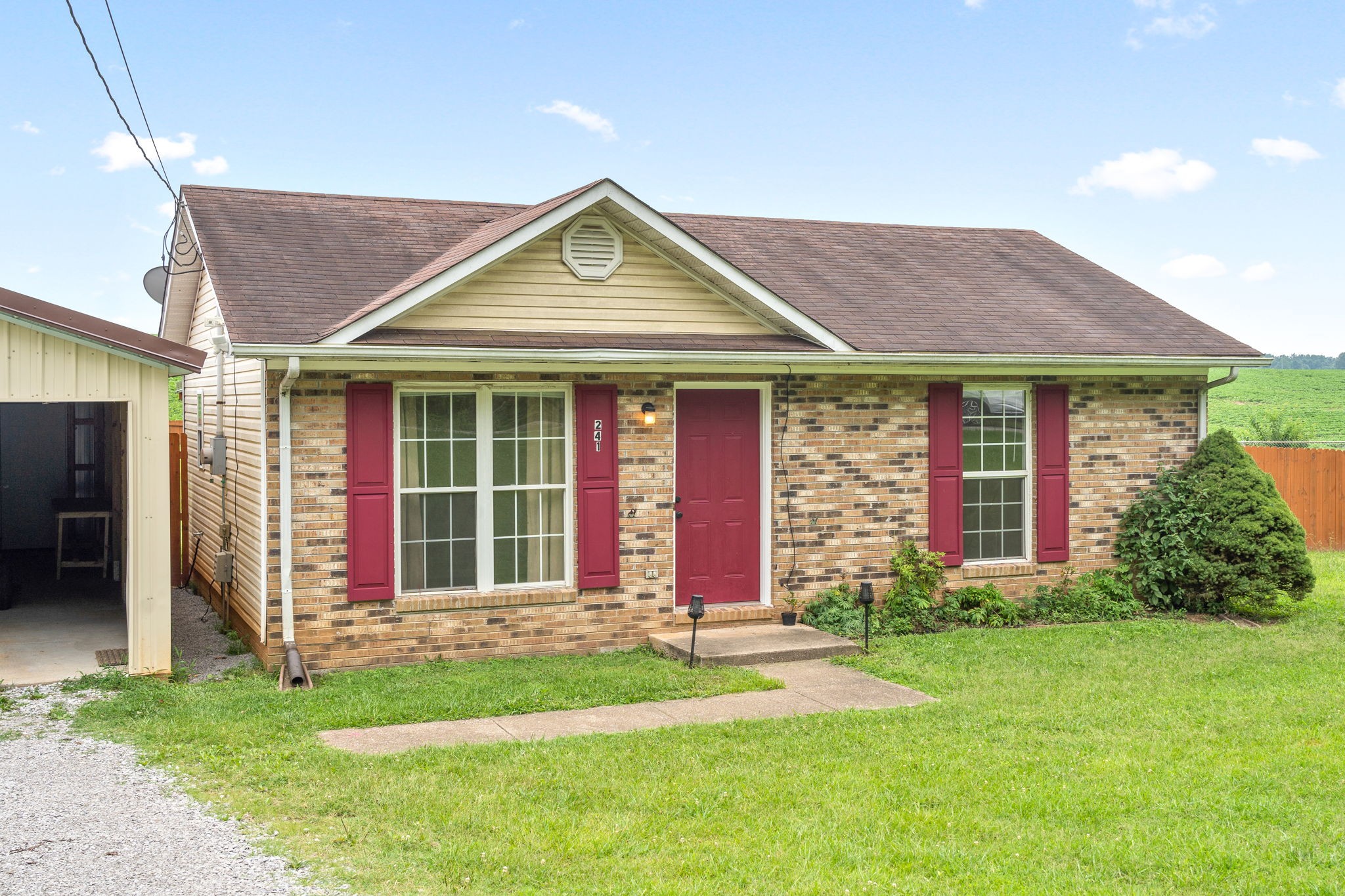 241 Bumpus Mill Road Oak Grove, KY 42262 - Photo 3 of 31 a front view of a house with a yard