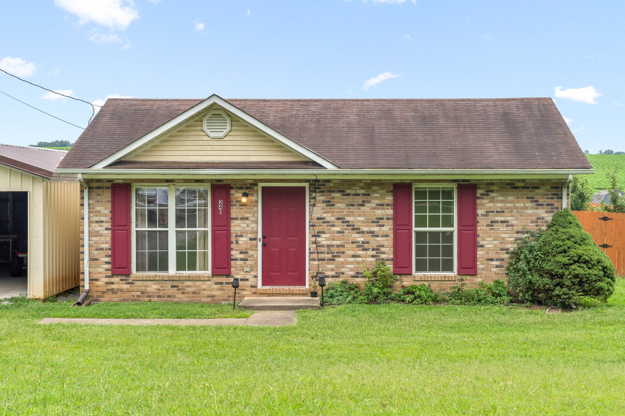241 Bumpus Mill Road Oak Grove, KY 42262 - Photo 4 of 31 a front view of a house with a yard