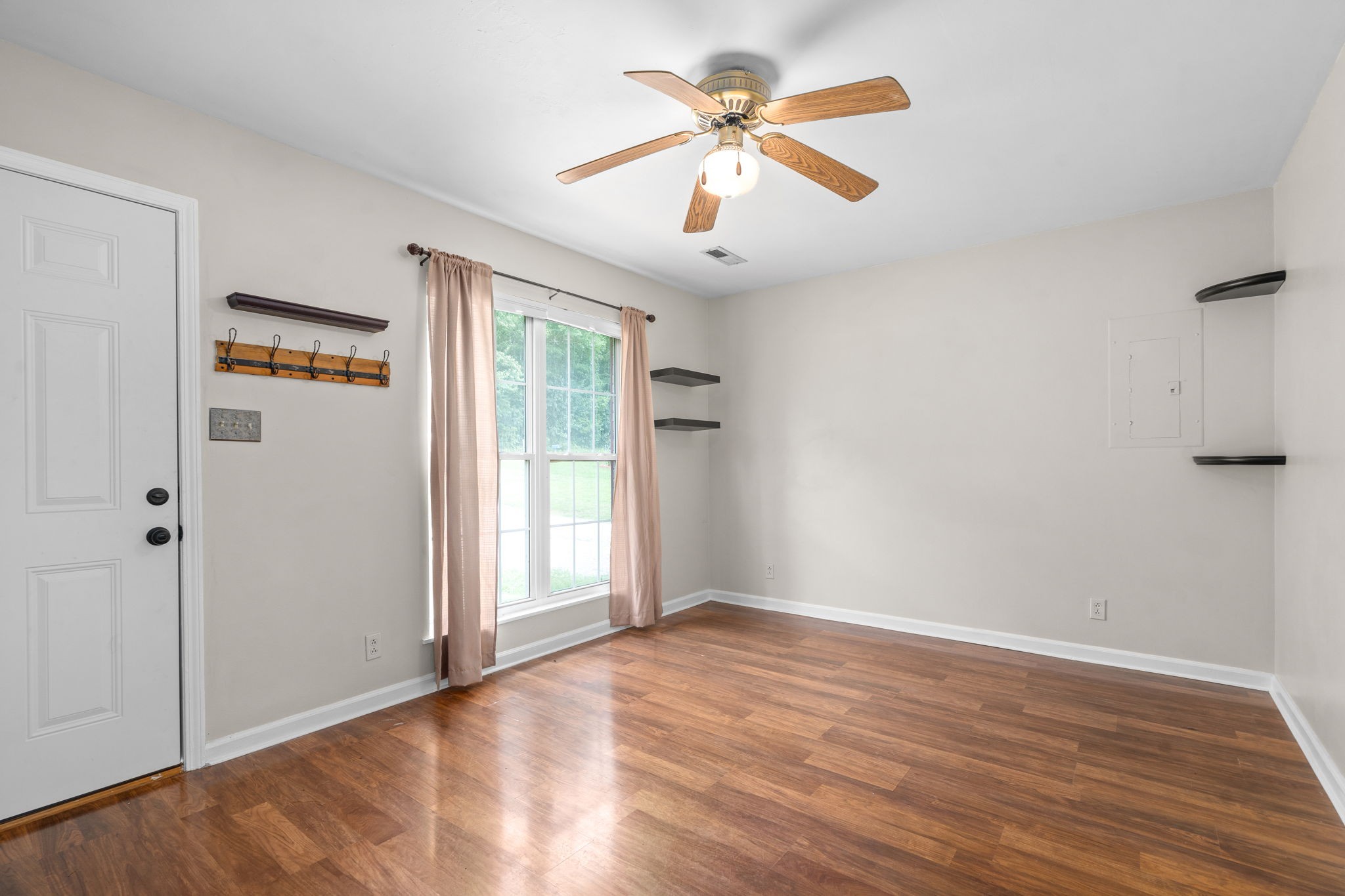 241 Bumpus Mill Road Oak Grove, KY 42262 - Photo 9 of 31 an empty room with wooden floor and windows