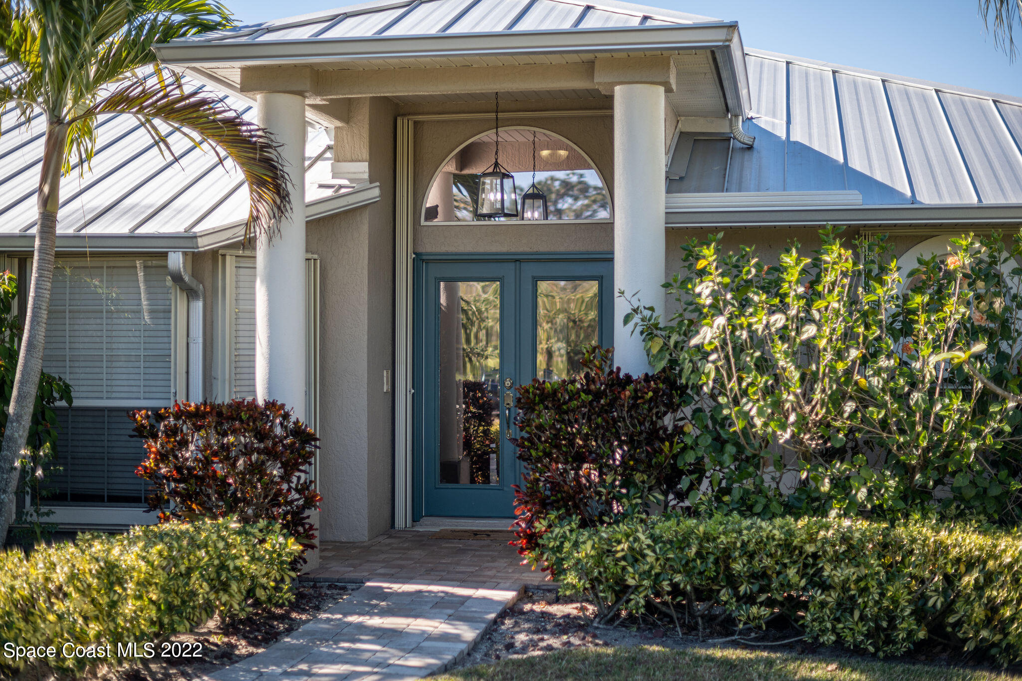 1566 Eagles Circle Sebastian, FL 32958 - Photo 11 of 59 a front view of a house with lots of yellow lighting