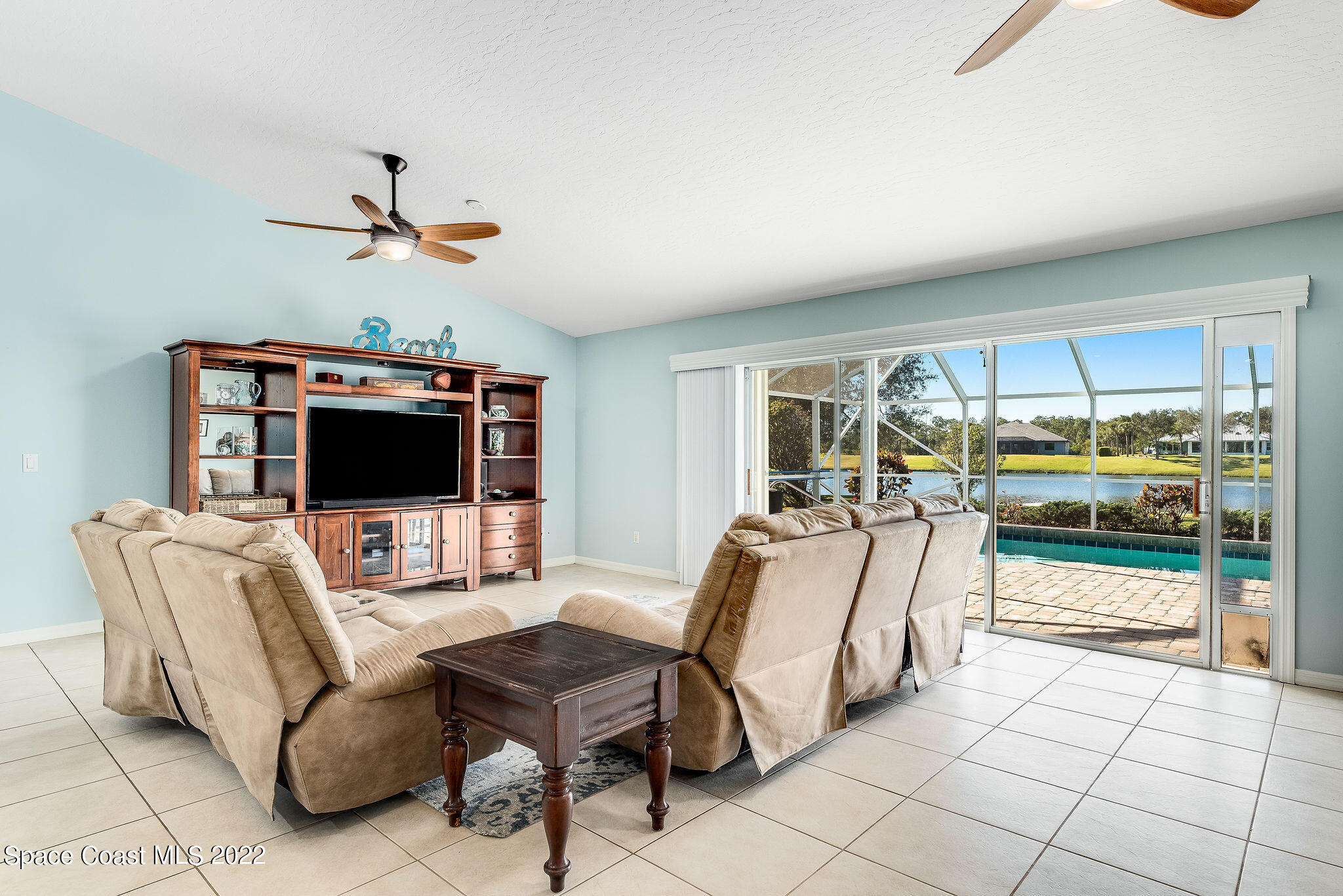1566 Eagles Circle Sebastian, FL 32958 - Photo 24 of 59 a living room with furniture and a flat screen tv