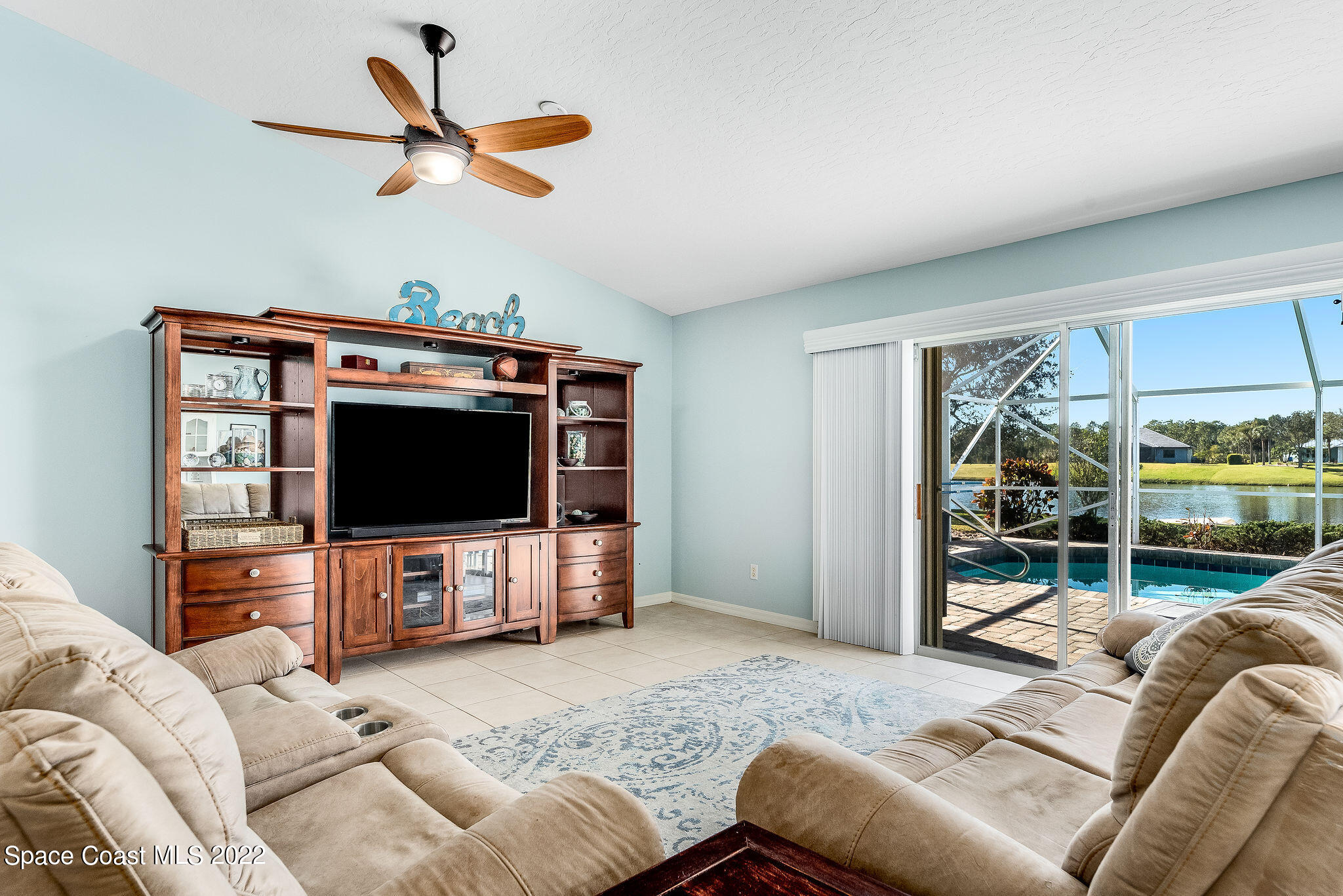 1566 Eagles Circle Sebastian, FL 32958 - Photo 26 of 59 a living room with furniture and a flat screen tv