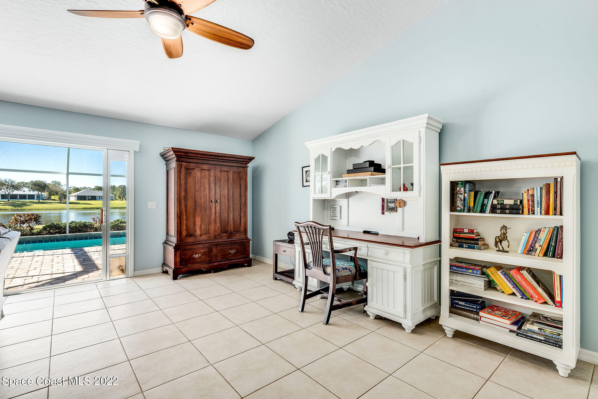 1566 Eagles Circle Sebastian, FL 32958 - Photo 27 of 59 a view of a workspace with furniture and a livingroom