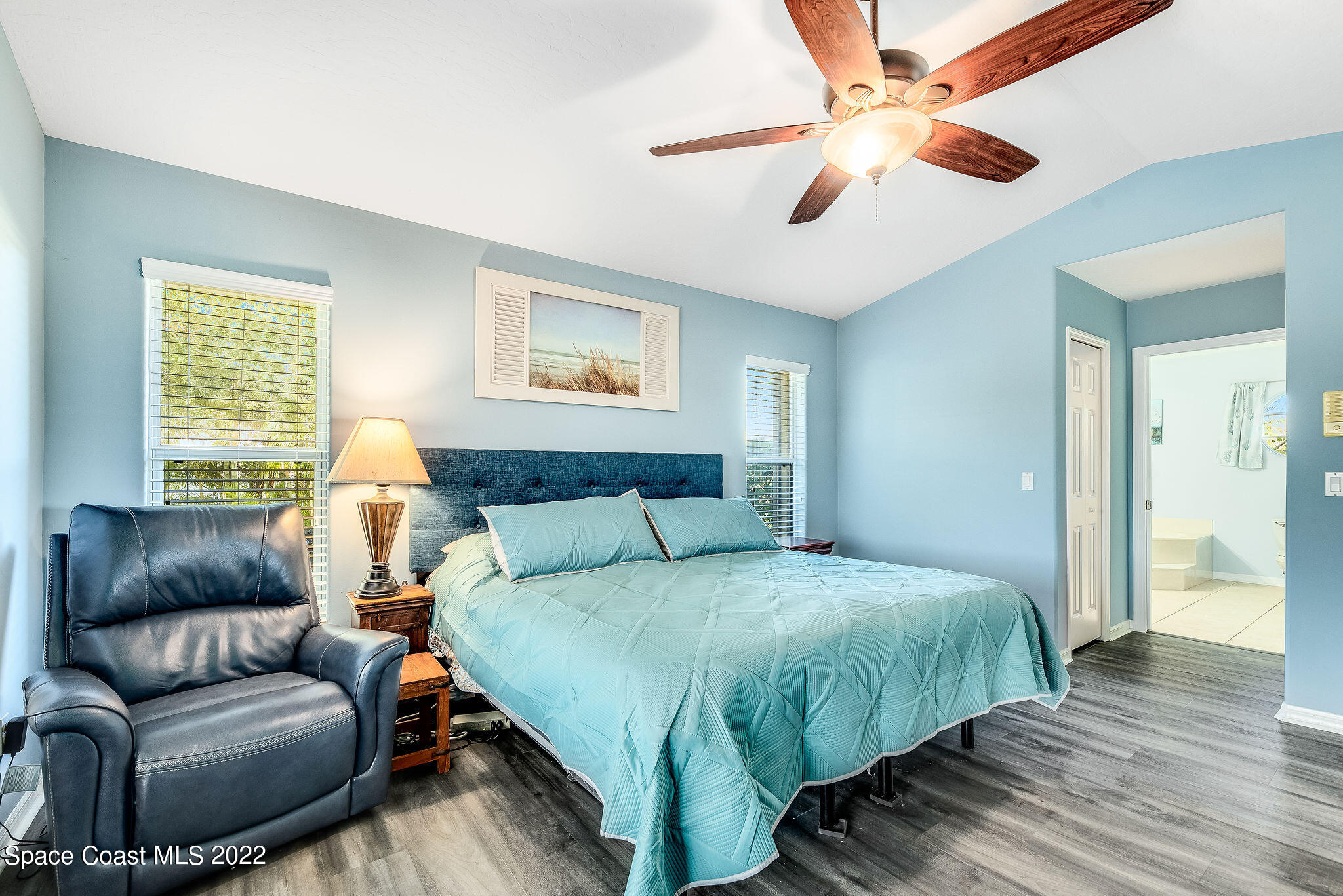 1566 Eagles Circle Sebastian, FL 32958 - Photo 31 of 59 a bedroom with a bed couch and window