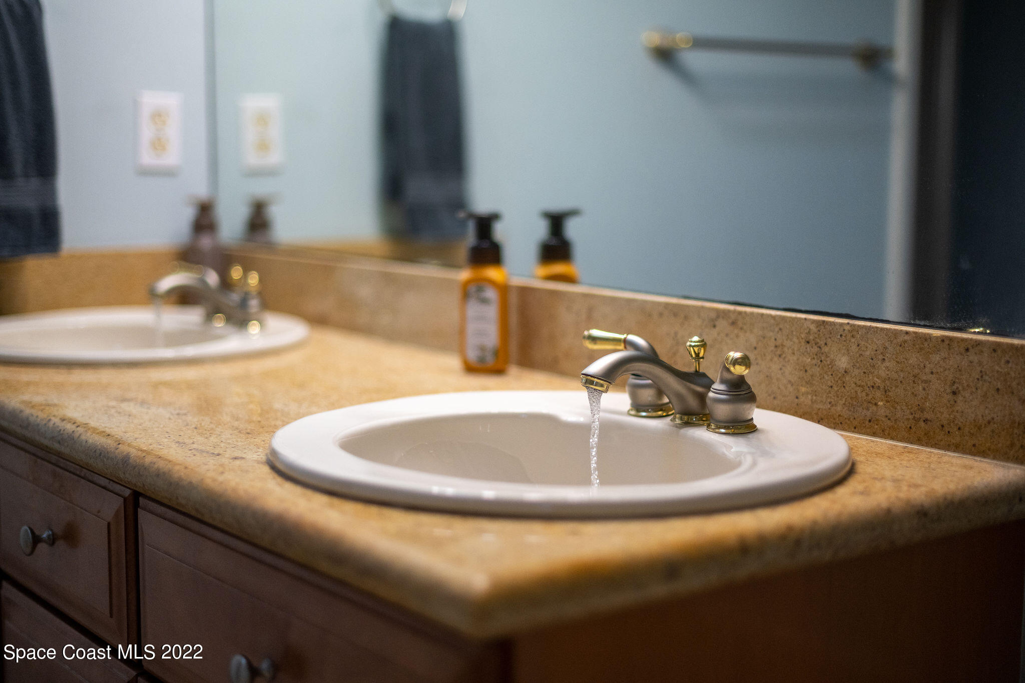 1566 Eagles Circle Sebastian, FL 32958 - Photo 35 of 59 a bathroom with a sink and a mirror
