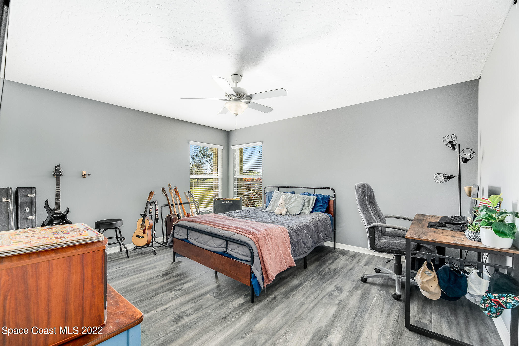 1566 Eagles Circle Sebastian, FL 32958 - Photo 38 of 59 a bedroom with a bed and a table in it