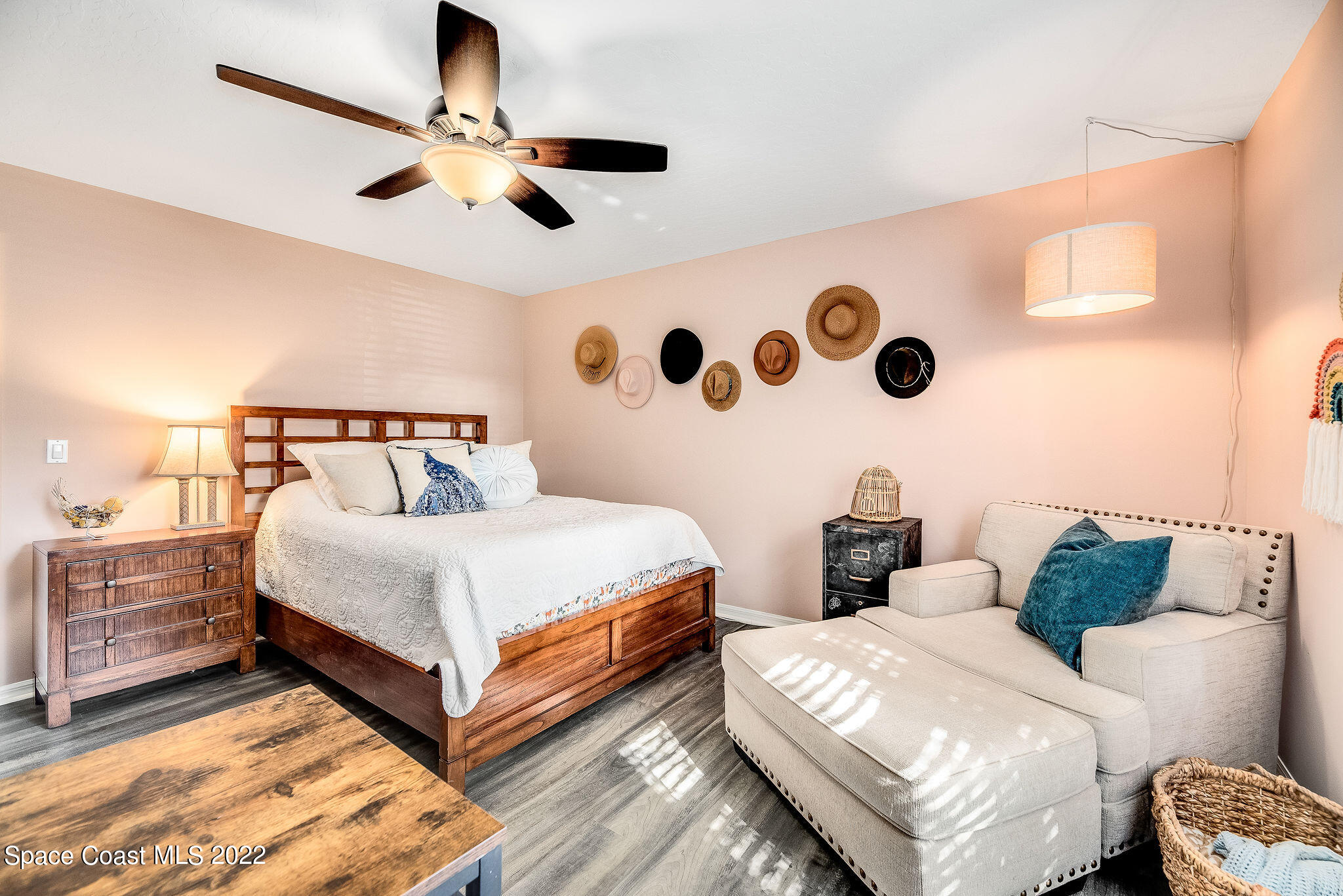 1566 Eagles Circle Sebastian, FL 32958 - Photo 41 of 59 a bedroom with bed and a chandelier