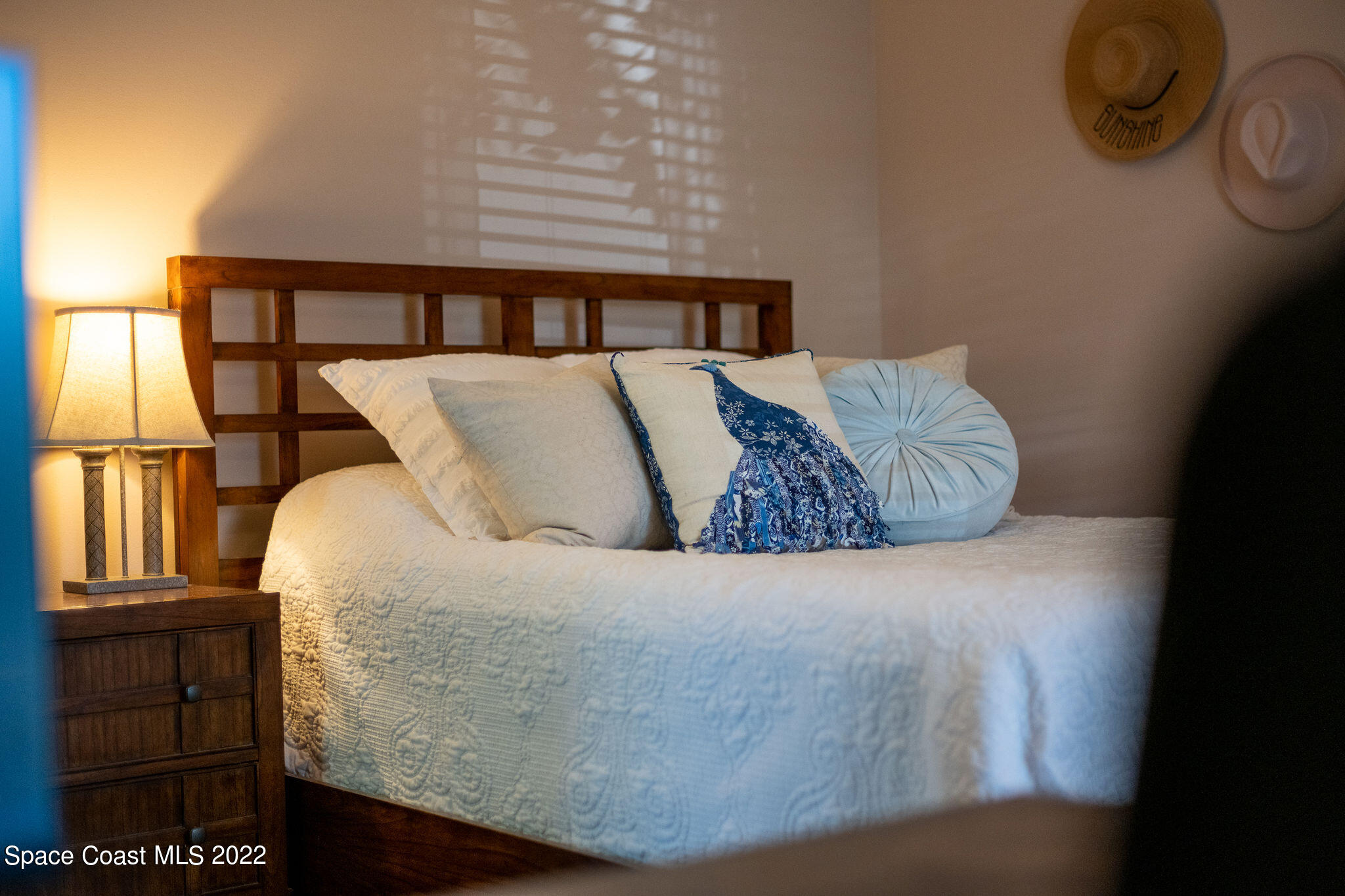 1566 Eagles Circle Sebastian, FL 32958 - Photo 43 of 59 a large bed sitting in a bedroom next to a window