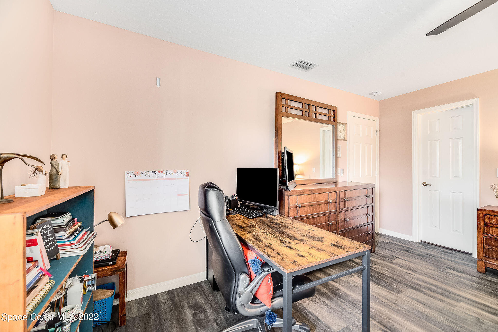 1566 Eagles Circle Sebastian, FL 32958 - Photo 44 of 59 a view of a workspace with furniture and wooden floor